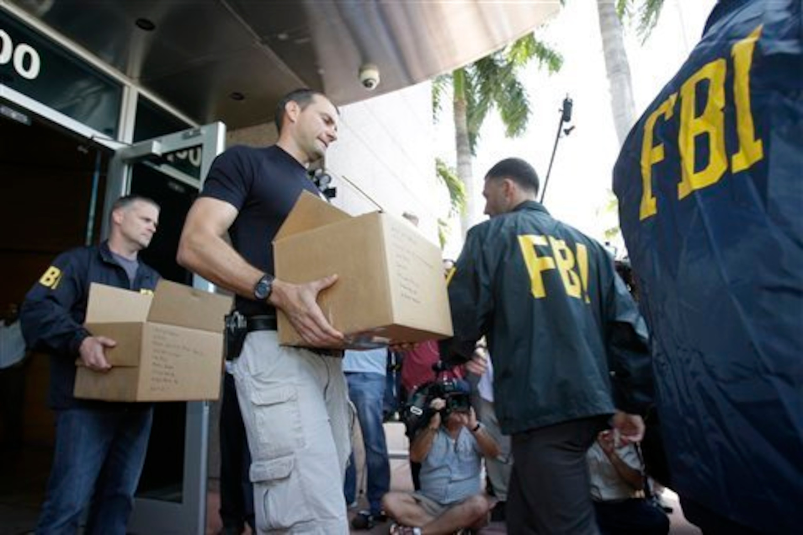 The FBI taking potential evidence from CONCACAF offices in Miami, Florida.