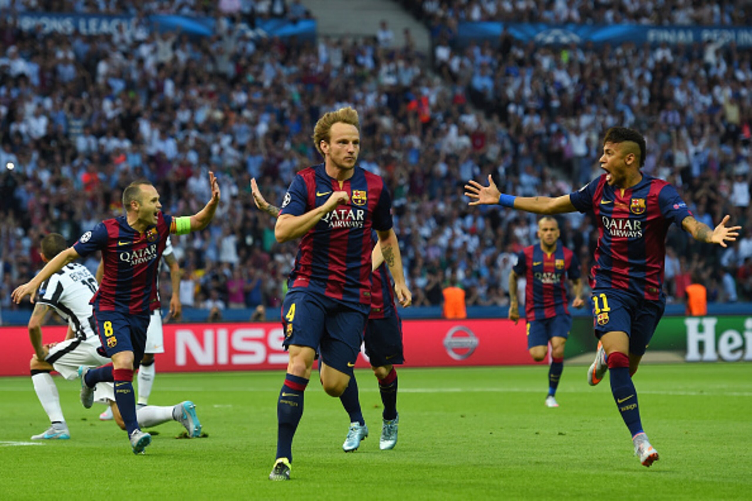 BERLIN, GERMANY - JUNE 06:  Ivan Rakitic of Barcelona celebrates scoring the opening goal with Neymar (R) and Andres Iniesta (L) during the UEFA Champions League Final between Juventus and FC Barcelona at Olympiastadion on June 6, 2015 in Berlin, Germany.
