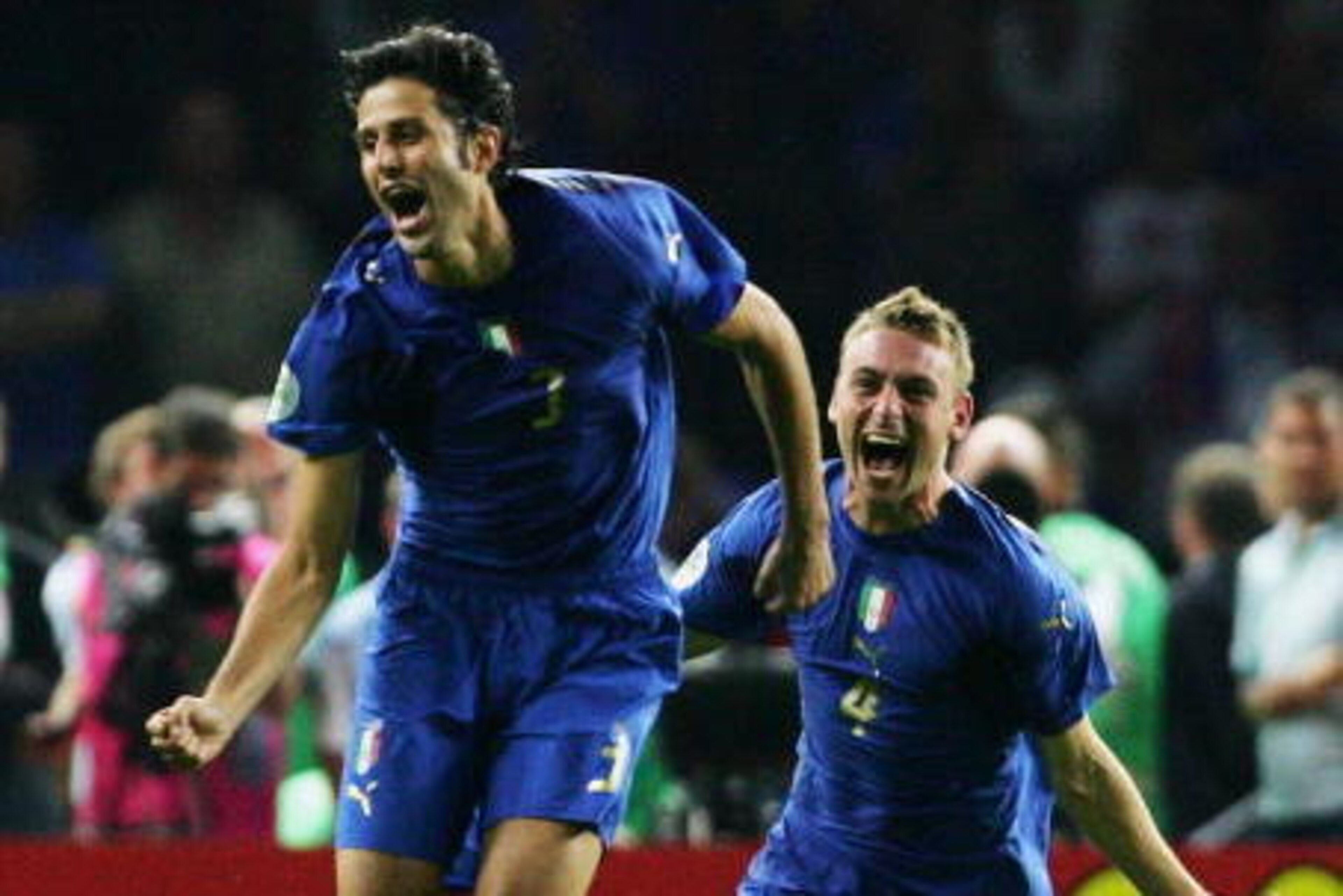 BERLIN - JULY 09:  Fabio Grosso (L) of Italy celebrates scoring the winning penalty in a penalty shootout with team mate Daniele De Rossi at the end of the FIFA World Cup Germany 2006 Final match between Italy and France at the Olympic Stadium on July 9, 