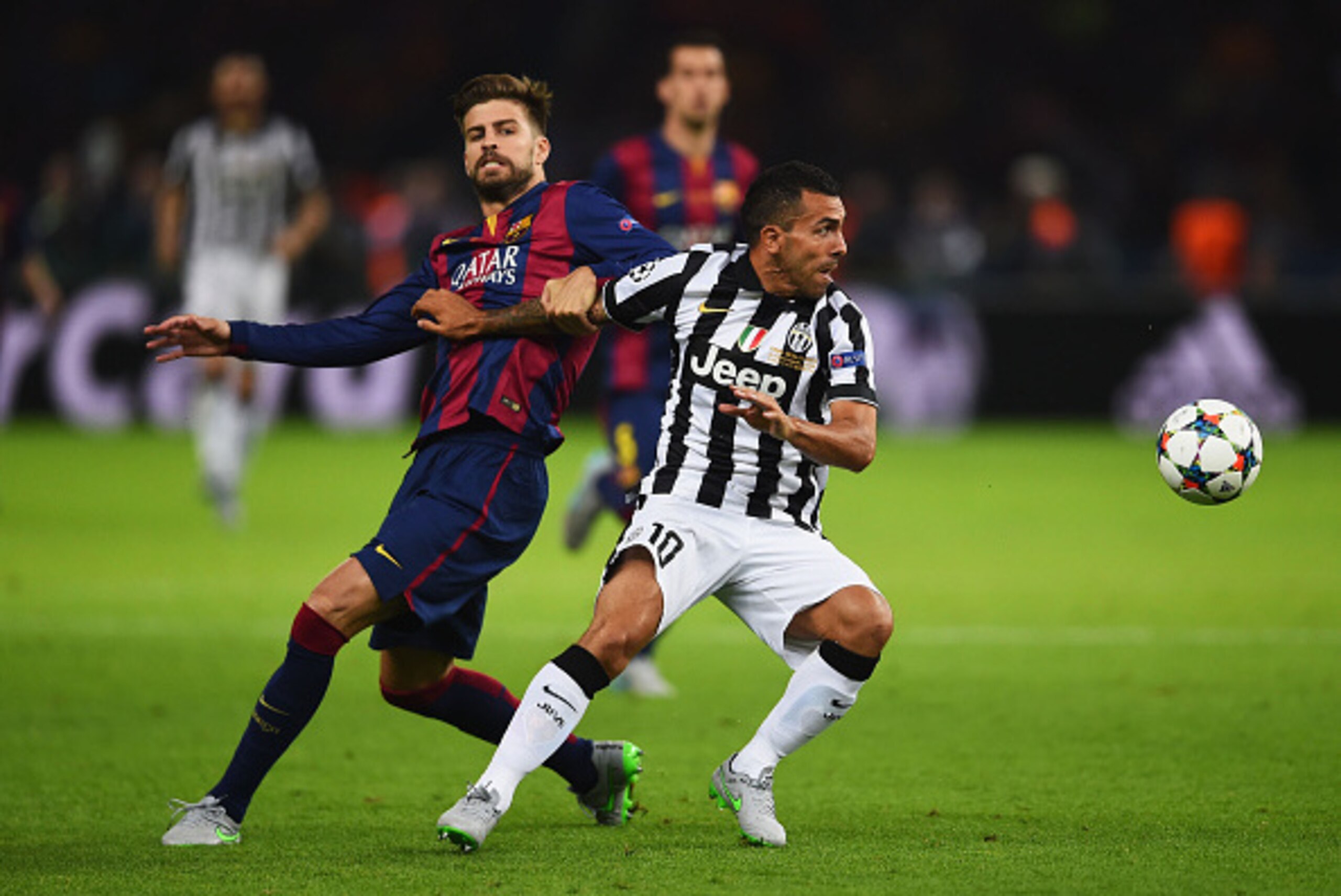BERLIN, GERMANY - JUNE 06: Carlos Tevez of Juventus evades Gerard Pique of Barcelona during the UEFA Champions League Final between Juventus and FC Barcelona at Olympiastadion on June 6, 2015 in Berlin, Germany. (Photo by Laurence Griffiths/Getty Images BERLIN, GERMANY - JUNE 06: Carlos Tevez of Juventus evades Gerard Pique of Barcelona during the UEFA Champions League Final between Juventus and FC Barcelona at Olympiastadion on June 6, 2015 in Berlin, Germany. (Photo by Laurence Griffiths/Getty Images