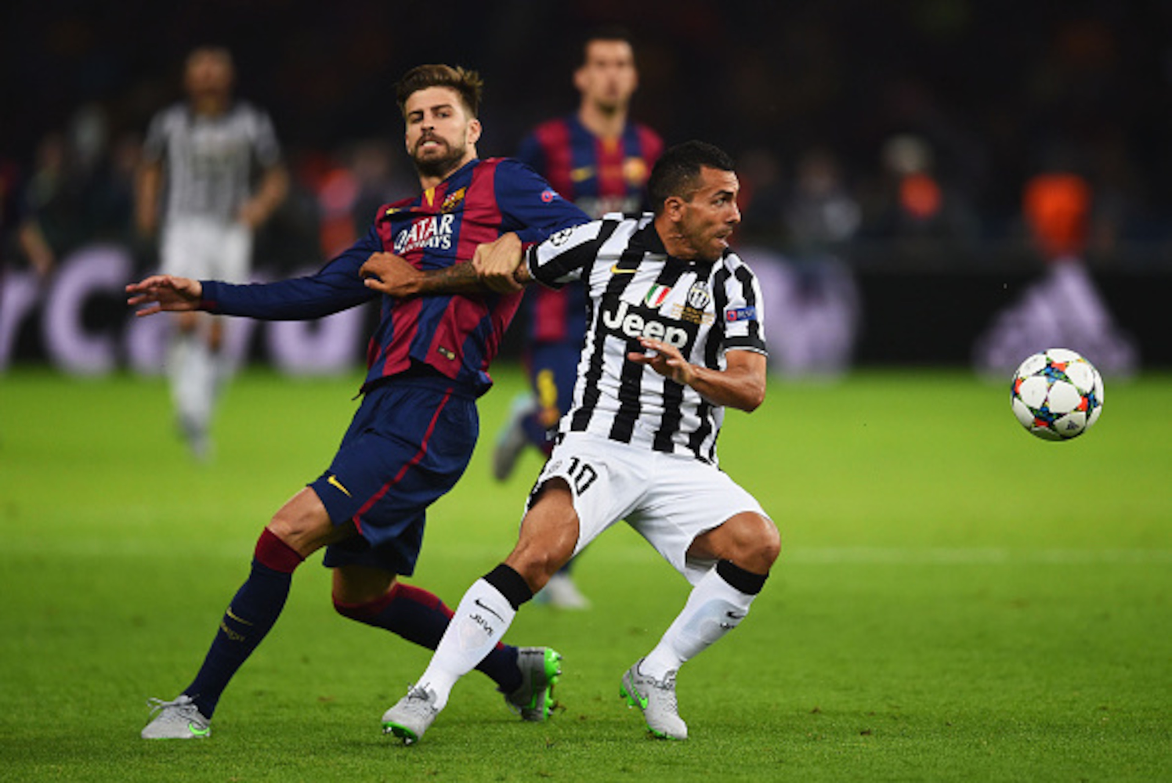 BERLIN, GERMANY - JUNE 06:  Carlos Tevez of Juventus evades Gerard Pique of Barcelona during the UEFA Champions League Final between Juventus and FC Barcelona at Olympiastadion on June 6, 2015 in Berlin, Germany.  (Photo by Laurence Griffiths/Getty Images