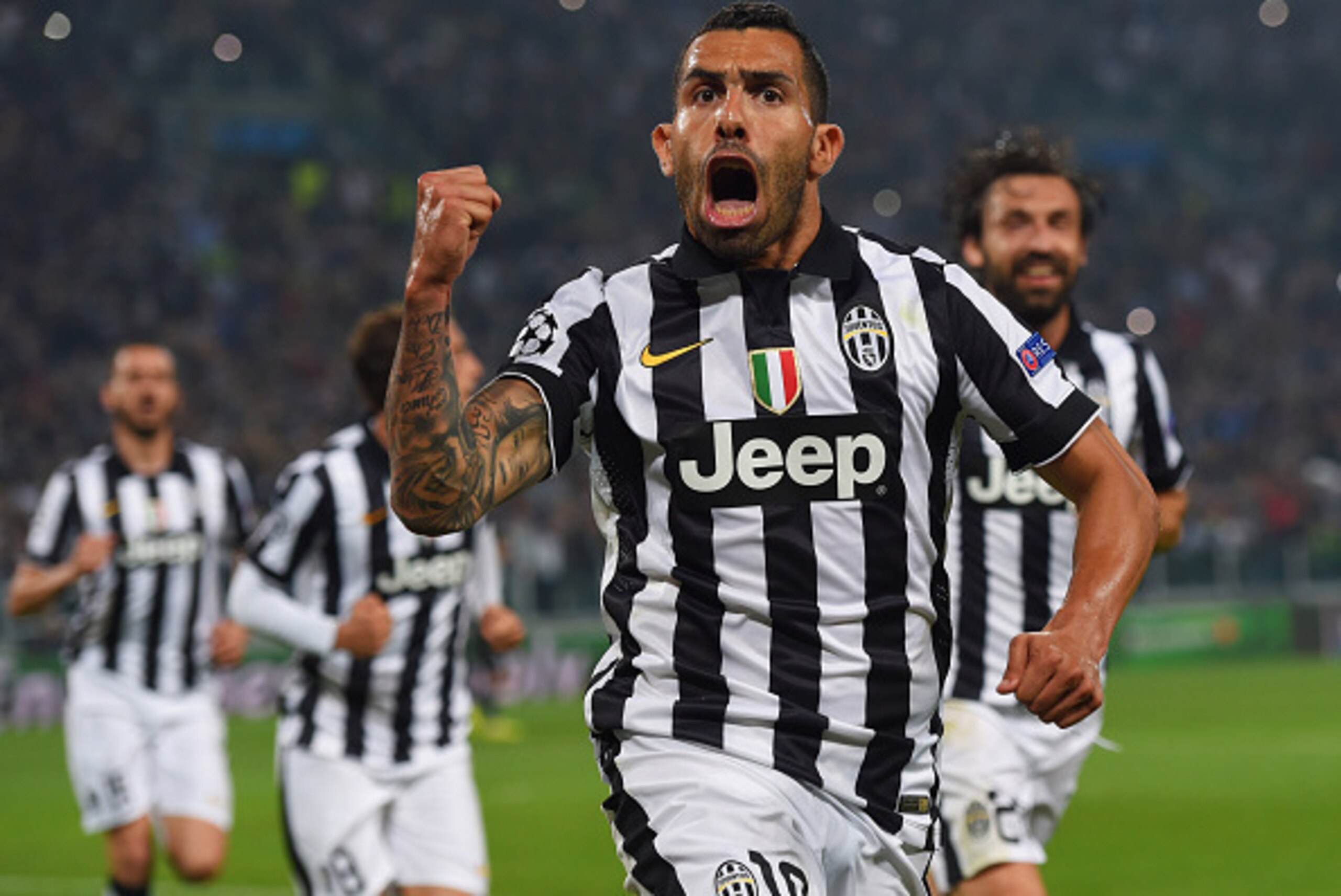 TURIN, ENGLAND - MAY 05: Carlos Tevez of Juventus celebrates as he scores their second goal from a penalty during the UEFA Champions League semi final first leg match between Juventus and Real Madrid CF at Juventus Arena on May 5, 2015 in Turin, Italy. TURIN, ENGLAND - MAY 05: Carlos Tevez of Juventus celebrates as he scores their second goal from a penalty during the UEFA Champions League semi final first leg match between Juventus and Real Madrid CF at Juventus Arena on May 5, 2015 in Turin, Italy.
