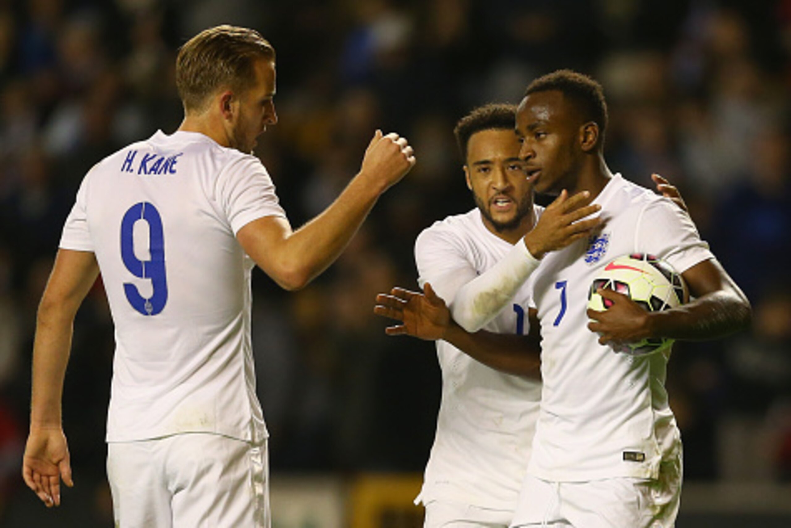 WOLVERHAMPTON, ENGLAND - OCTOBER 10: Saido Berahino of England is congratulated by team mates Nathan Redmond and Harry Kane after he was fouled by Dominik Livakovic of Croatia to be awarded a penalty which he scored to win the match during the UEFA U21 C WOLVERHAMPTON, ENGLAND - OCTOBER 10: Saido Berahino of England is congratulated by team mates Nathan Redmond and Harry Kane after he was fouled by Dominik Livakovic of Croatia to be awarded a penalty which he scored to win the match during the UEFA U21 C