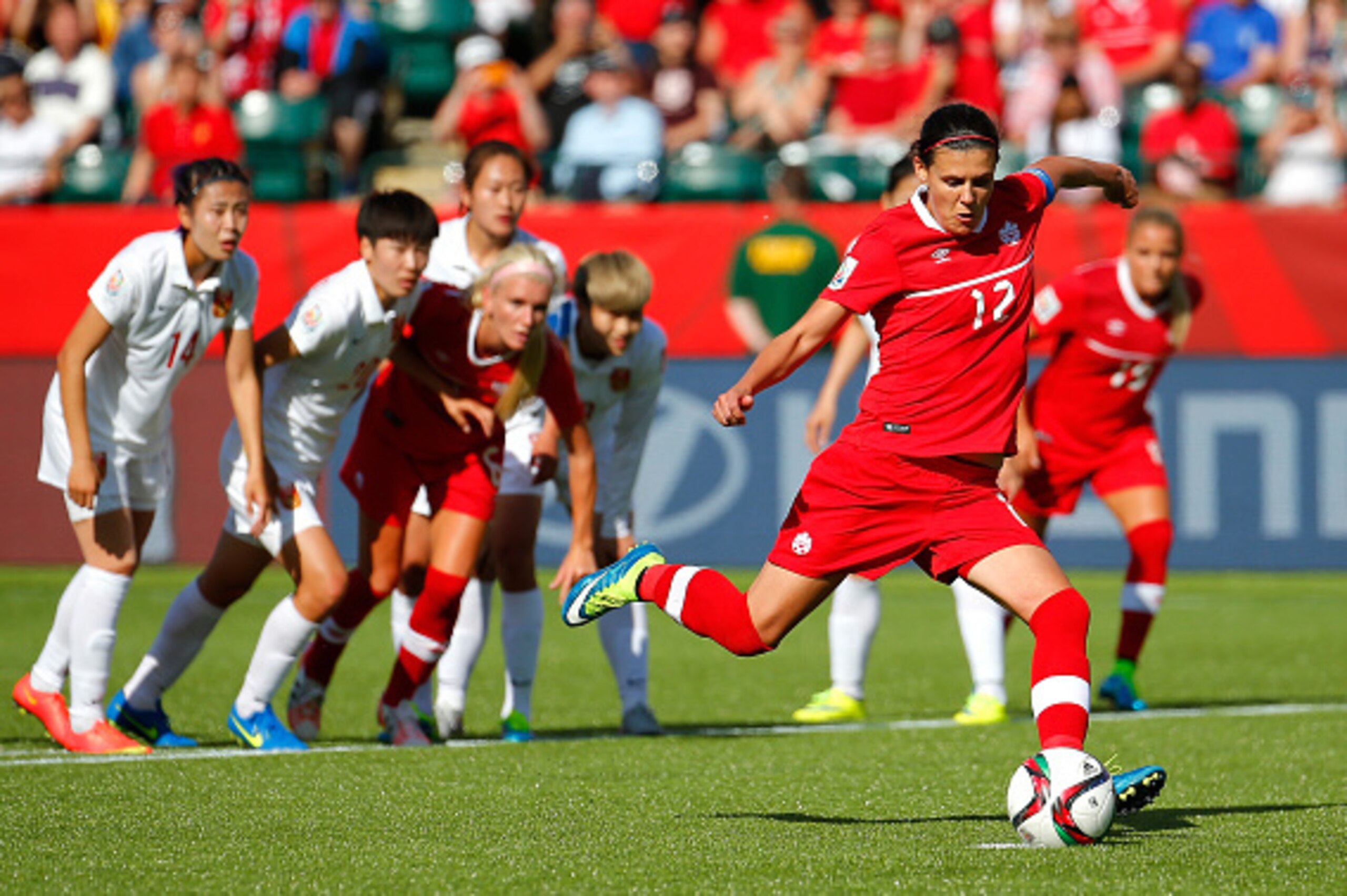 EDMONTON, AB - JUNE 06:  Christine Sinclair #12 of Canada kicks the go-ahead goal on a penalty kick in the final minutes against China PR during the FIFA Women's World Cup Canada 2015 Group A match between Canada and China PR at Commonwealth Stadium on Ju