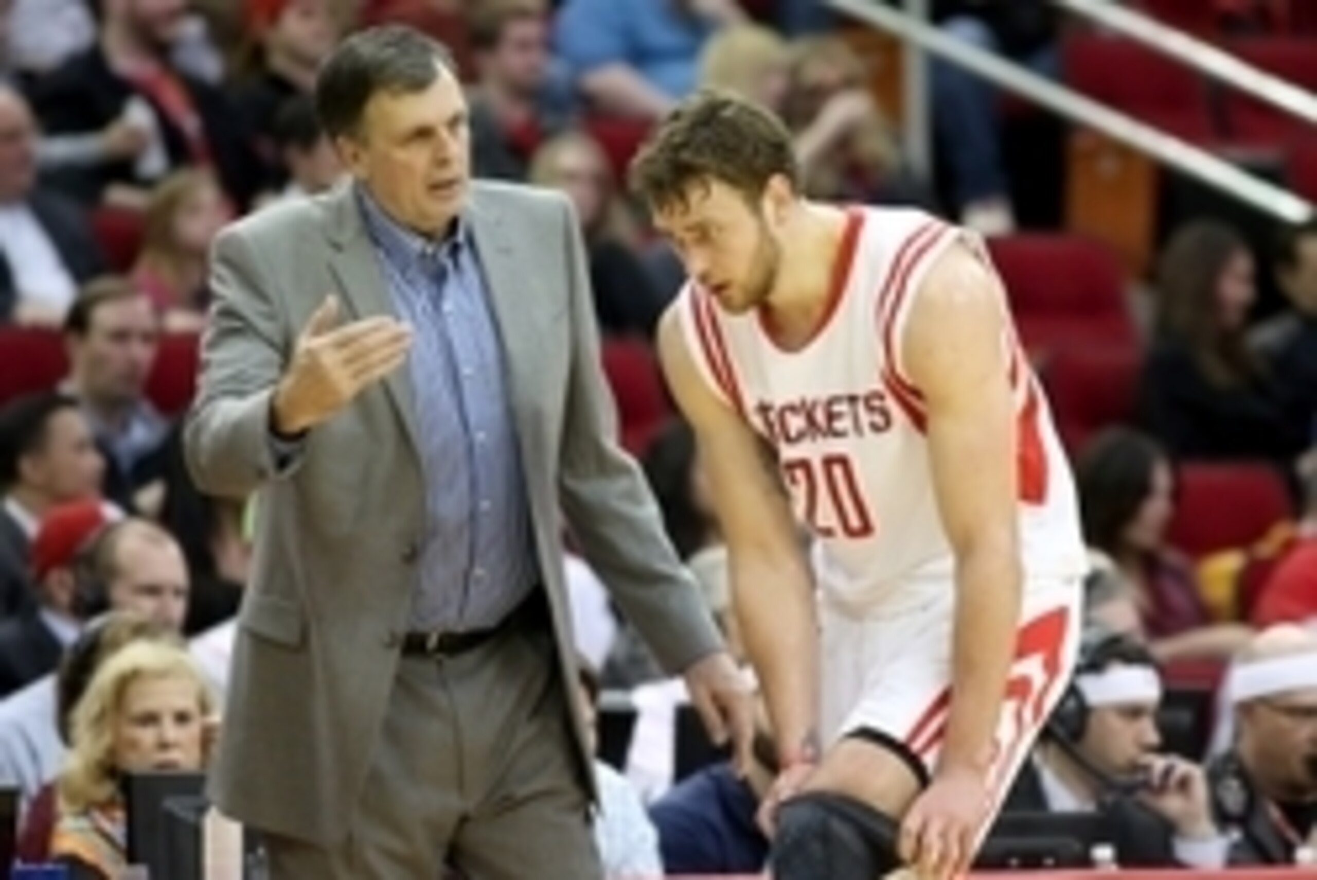 Feb 4, 2015; Houston, TX, USA; Houston Rockets head coach Kevin McHale talks with forward Donatas Motiejunas (20) on the sidelines during a Chicago Bulls timeout in the first half at Toyota Center. Mandatory Credit: Thomas B. Shea-USA TODAY Sports