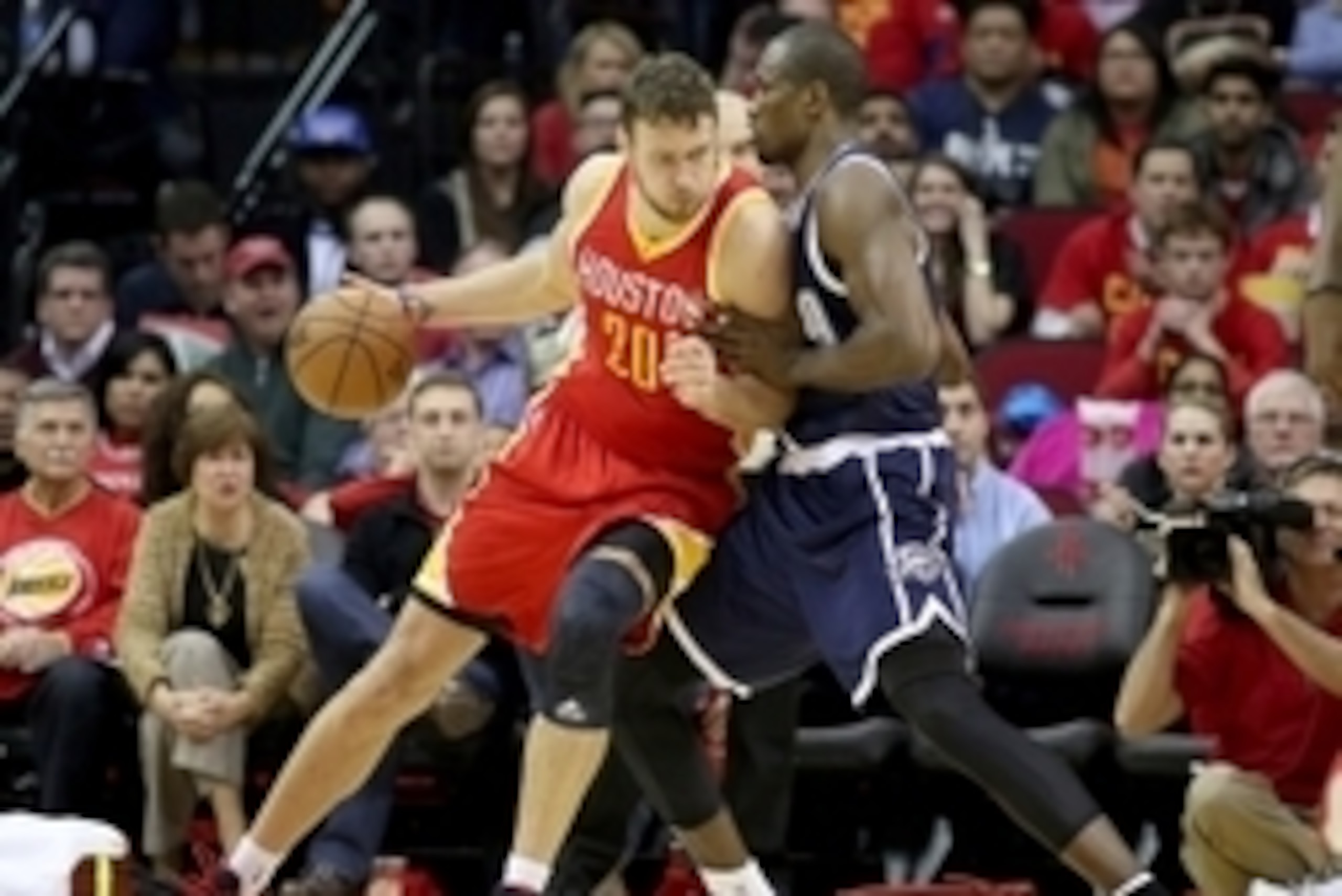 Jan 15, 2015; Houston, TX, USA; Houston Rockets forward Donatas Motiejunas (20) dribbles the ball as Oklahoma City Thunder forward Serge Ibaka (9) defends in the second half at Toyota Center. The Rockets won 112-101. Mandatory Credit: Thomas B. Shea-USA T