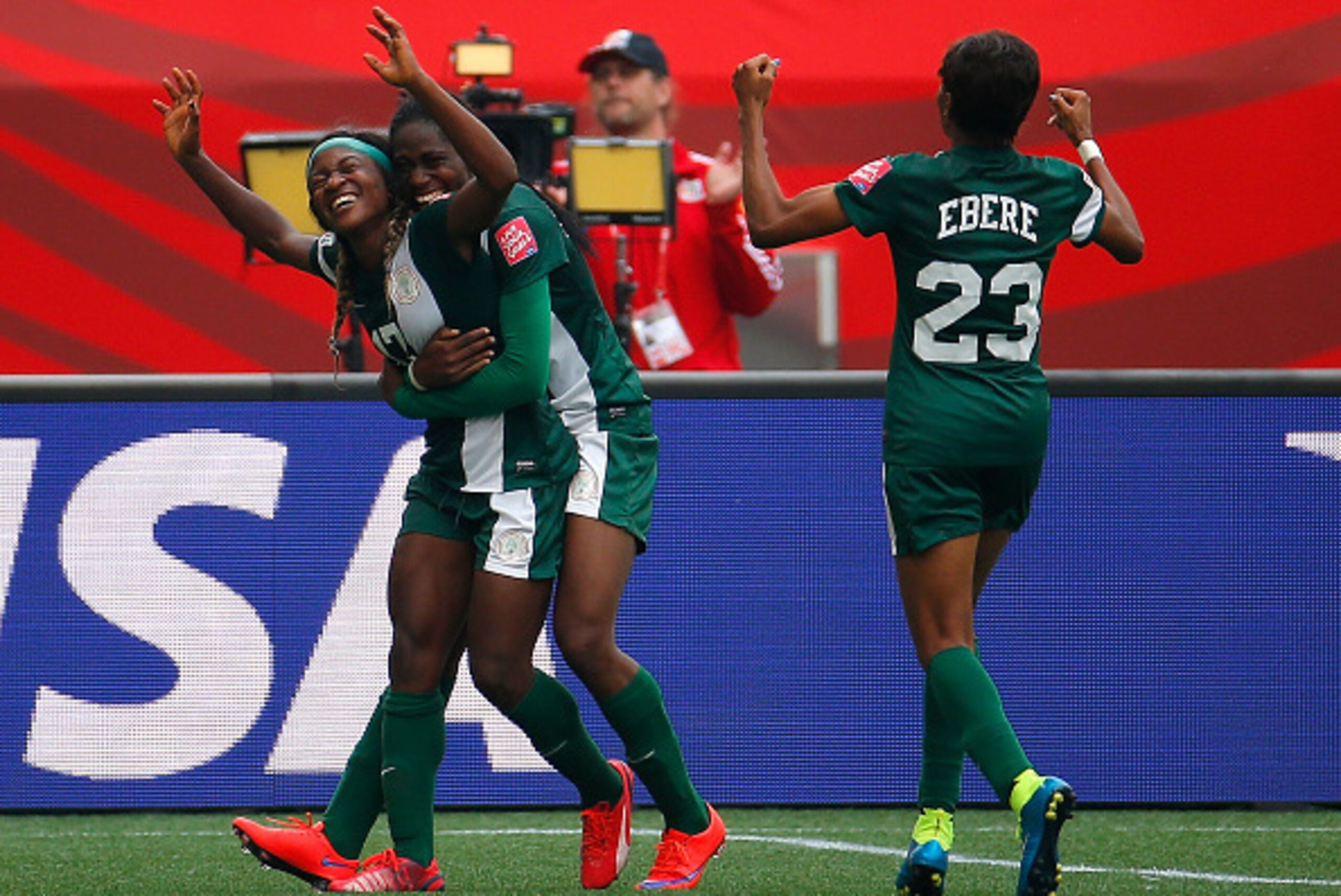 WINNIPEG, MB - JUNE 08:  Francisca Ordega #17 of Nigeria celebrates her game-tying goal against Sweden with Asisat Oshoala #8 and Ngozi Ebere #23 during the FIFA Women's World Cup Canada 2015 Group D match between Sweden and Nigeria at Winnipeg Stadium on