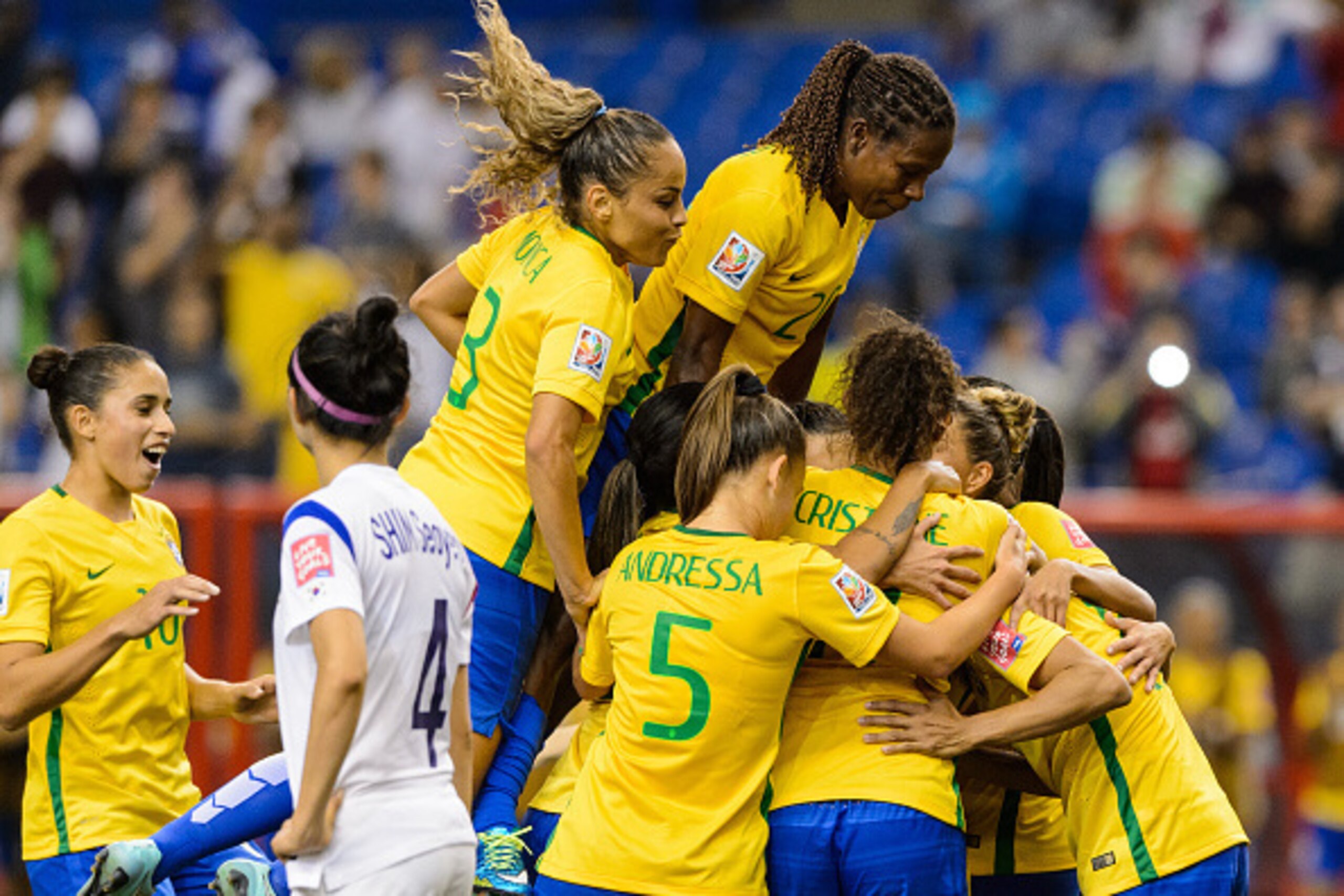 MONTREAL, QC - JUNE 09:  Marta #10 of Brazil celebrates a goal on a penalty kick with teammates in the second half during the 2015 FIFA Women's World Cup Group E match against Korea Republic at Olympic Stadium on June 9, 2015 in Montreal, Quebec, Canada. 