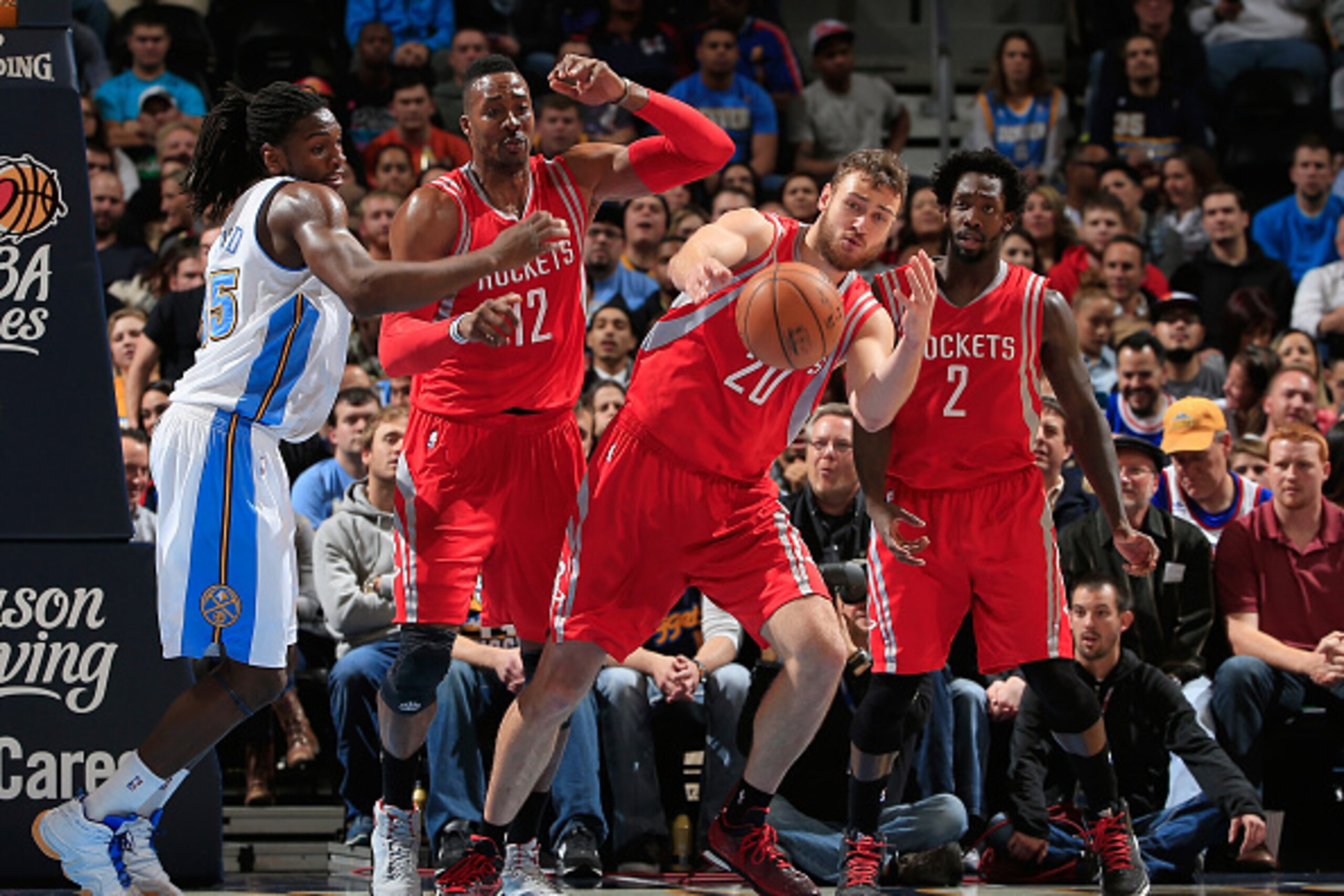 DENVER, CO - DECEMBER 17:  Donatas Motiejunas #20 of the Houston Rockets looks to control the ball as Kenneth Faried #35 of the Denver Nuggets, Dwight Howard #12 of the Houston Rockets and Patrick Beverley #2 of the Houston Rockets follow the play at Peps