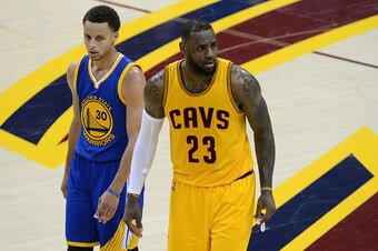 CLEVELAND, OH - JUNE 9:  Stephen Curry #30 of the Golden State Warriors and LeBron James #23 of the Cleveland Cavaliers look on in Game Three of the 2015 NBA Finals on June 9, 2015 at Quicken Loans Arena in Cleveland. Ohio.  NOTE TO USER: User expressly a