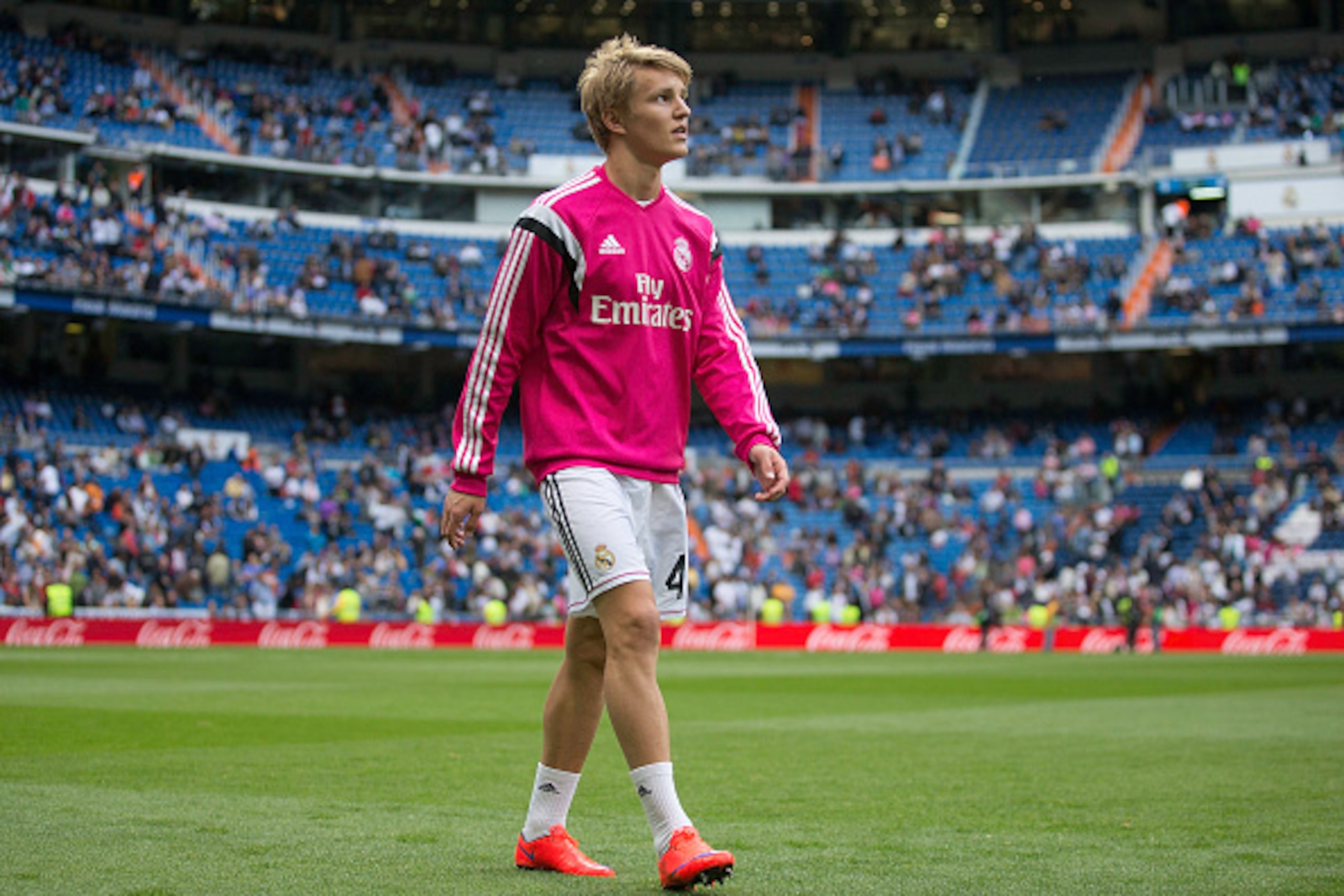 MADRID, SPAIN - APRIL 29:  Martin Odegaard of Real Madrid CF leaves the pitch after his warming up before  the La Liga match between Real Madrid CF and UD Almeria at Estadio Santiago Bernabeu on April 29, 2015 in Madrid, Spain.  (Photo by Gonzalo Arroyo M
