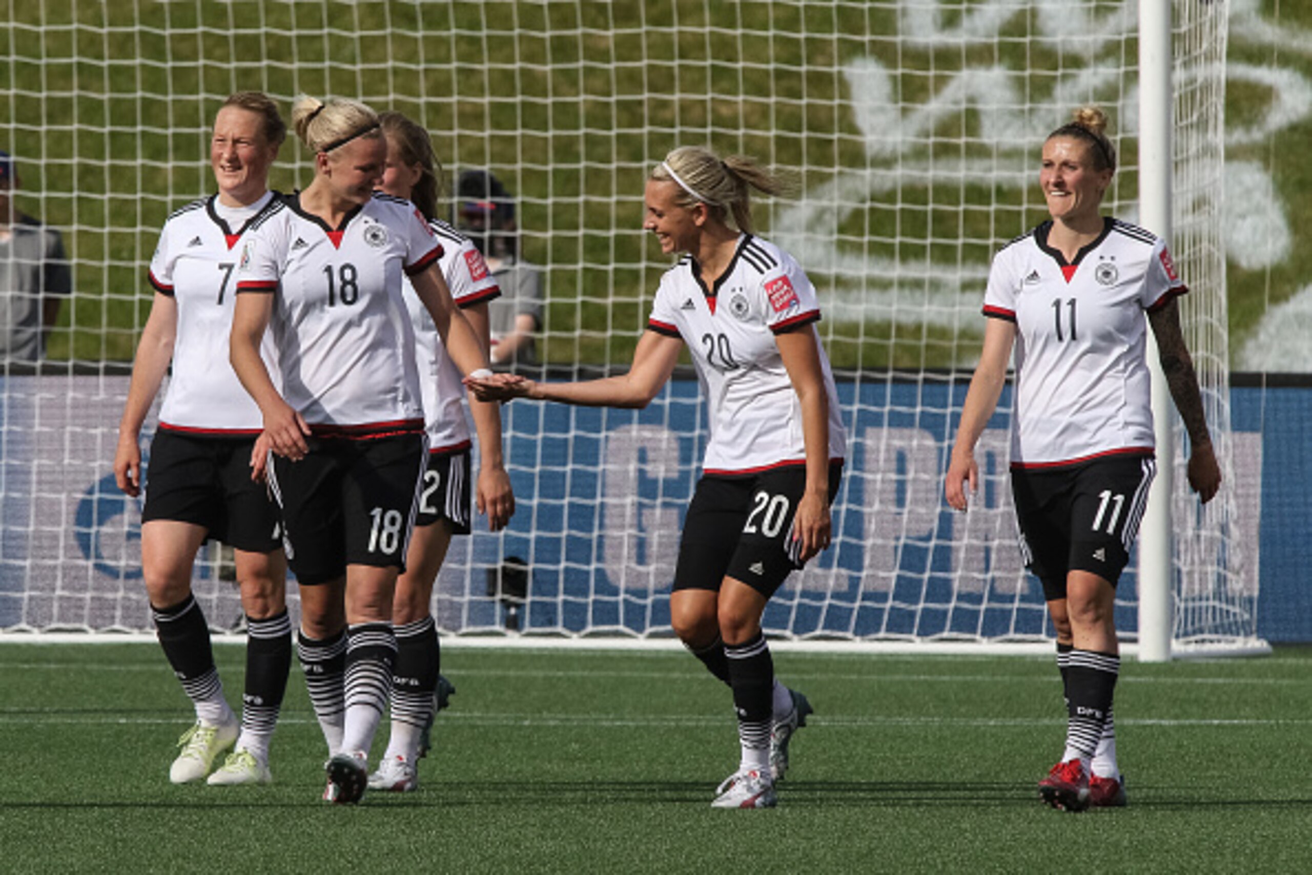 OTTAWA, ON - JUNE 7: Alexandra Popp #18 of Germany celebrates a goal with teammate Lena Goessling #20 during the FIFA Women's World Cup Canada 2015 Group B match between Germany and Cote d'Ivoire at Lansdowne Stadium on June 7, 2015 in Ottawa, Canada.  (P