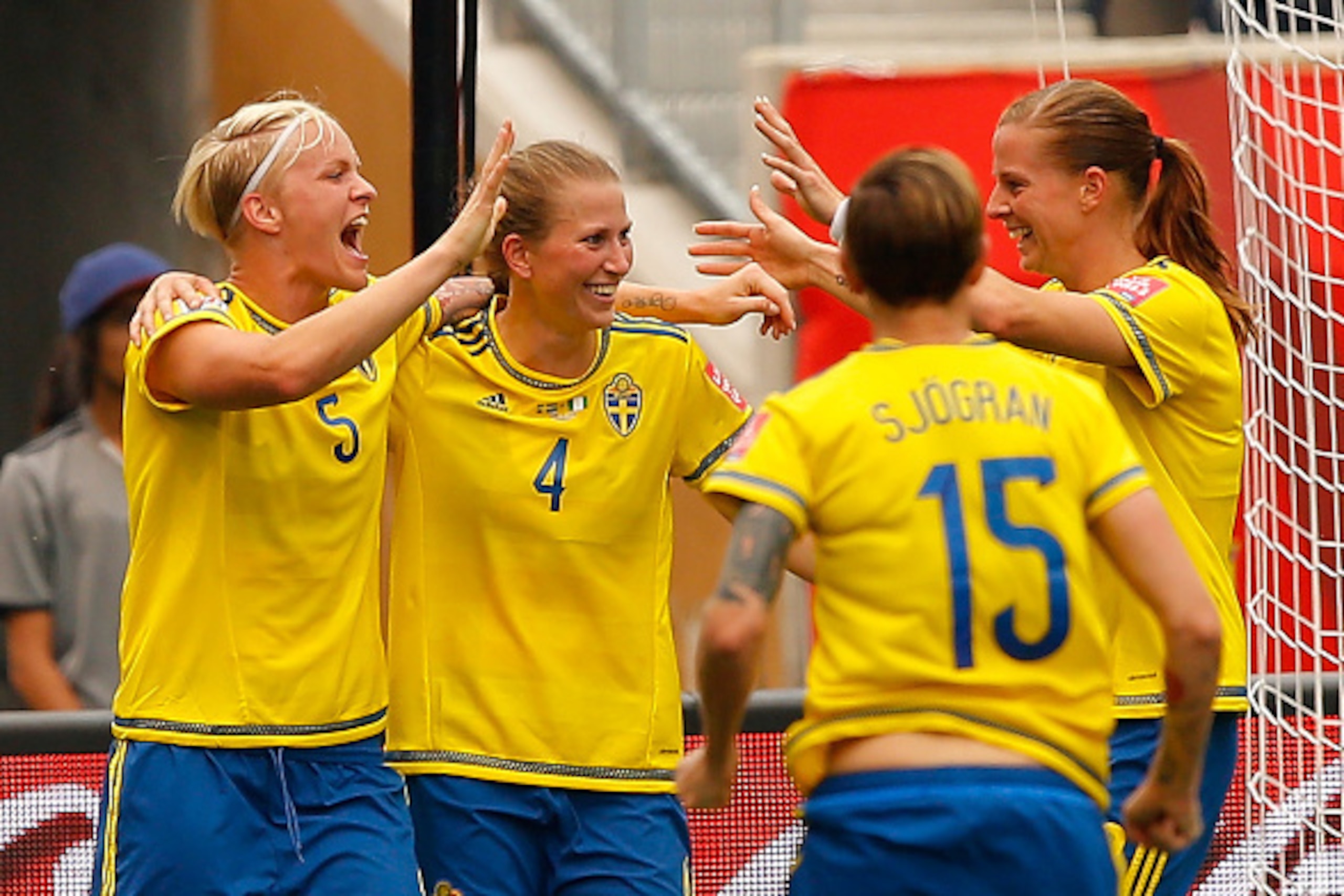 WINNIPEG, MB - JUNE 08:  Nilla Fischer #5 of Sweden reacts after scoring the second goal against Nigeria with Emma Berglund #4, Therese Sjogran #15, and Lotta Schelin #8 during the FIFA Women's World Cup Canada 2015 Group D match between Sweden and Nigeri