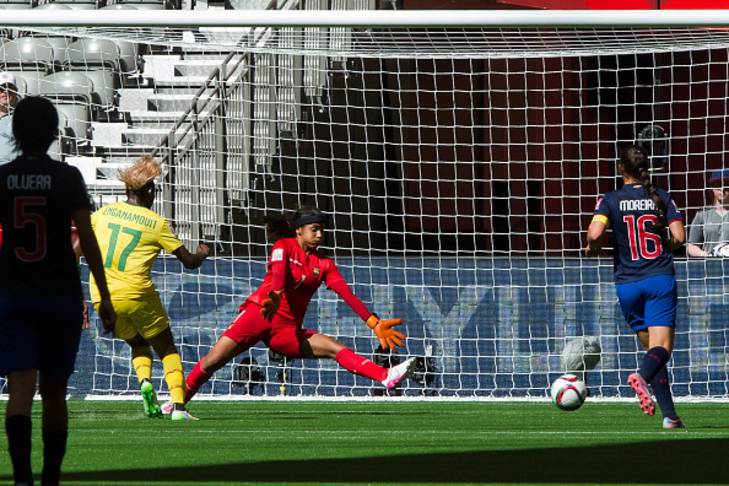 VANCOUVER, BC - MAY 8:  Gaelle Enganamouit #17 of Cameroon shoots the ball past goalkeeper Shirley Berruz #1 of Ecuador during the FIFA Women's World Cup Canada 2015 Group C match between Cameroon and Ecuador June, 8, 2015 at BC Place Stadium in Vancouver