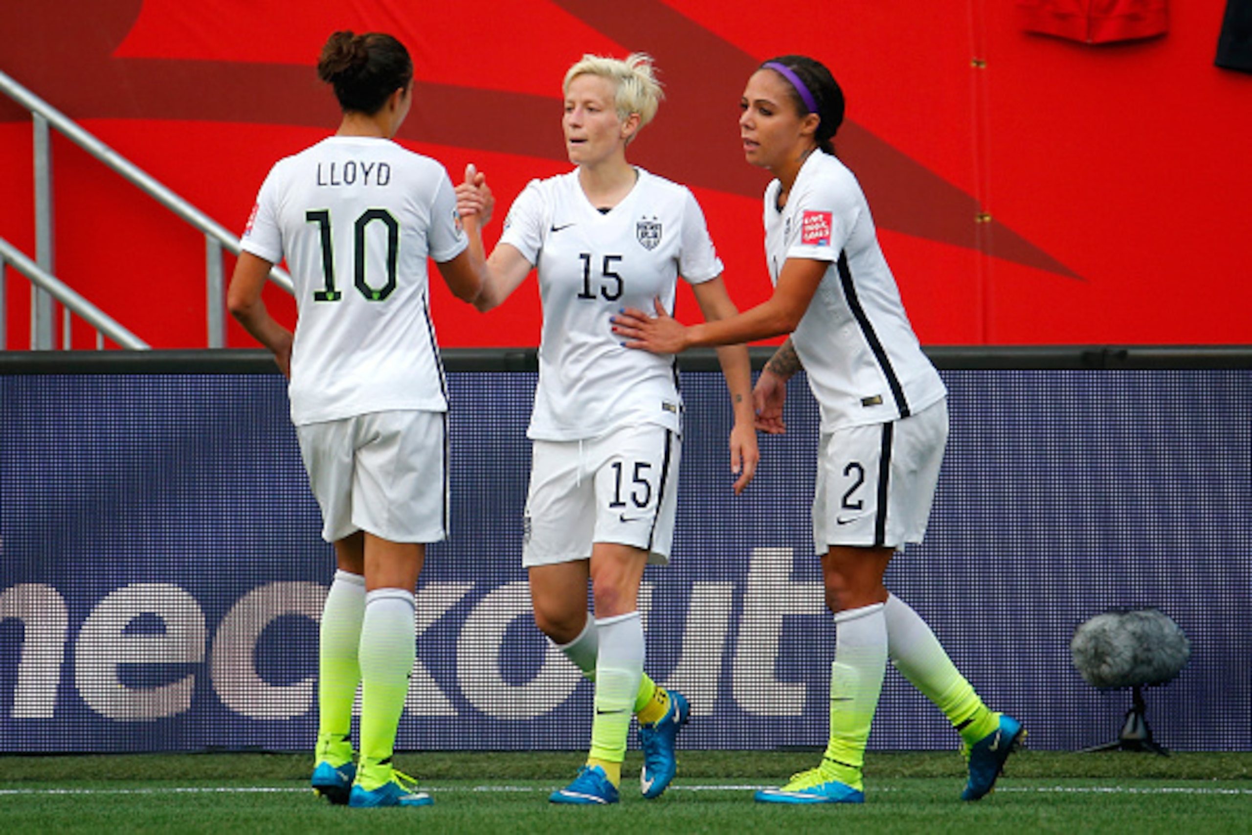 WINNIPEG, MB - JUNE 08:  Megan Rapinoe #15 celebrates with Carli Lloyd #10 and Sydney Leroux #2 of United States after Rapinoe scores her second goal against Australia in the second half during the FIFA Women's World Cup 2015 Group D match at Winnipeg Sta