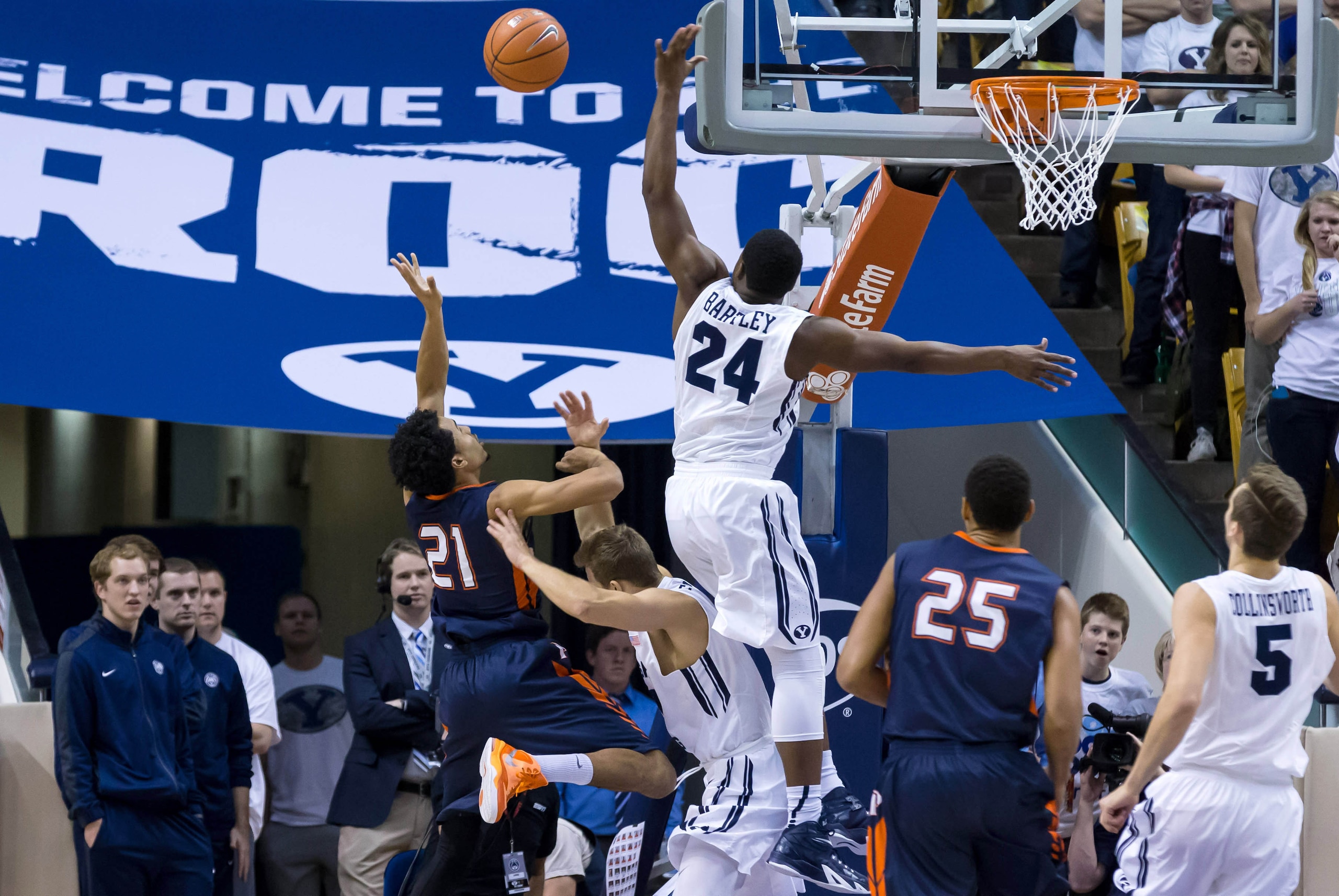 Jan 8, 2015; Provo, UT, USA; Pepperdine Waves guard Shawn Olden (21) tries to shoot the ball over Brigham Young Cougars guard Frank Bartley IV (24) during the second half at Marriott Center. Pepperdine Waves won the game 67-61. Mandatory Credit: Chris Nic