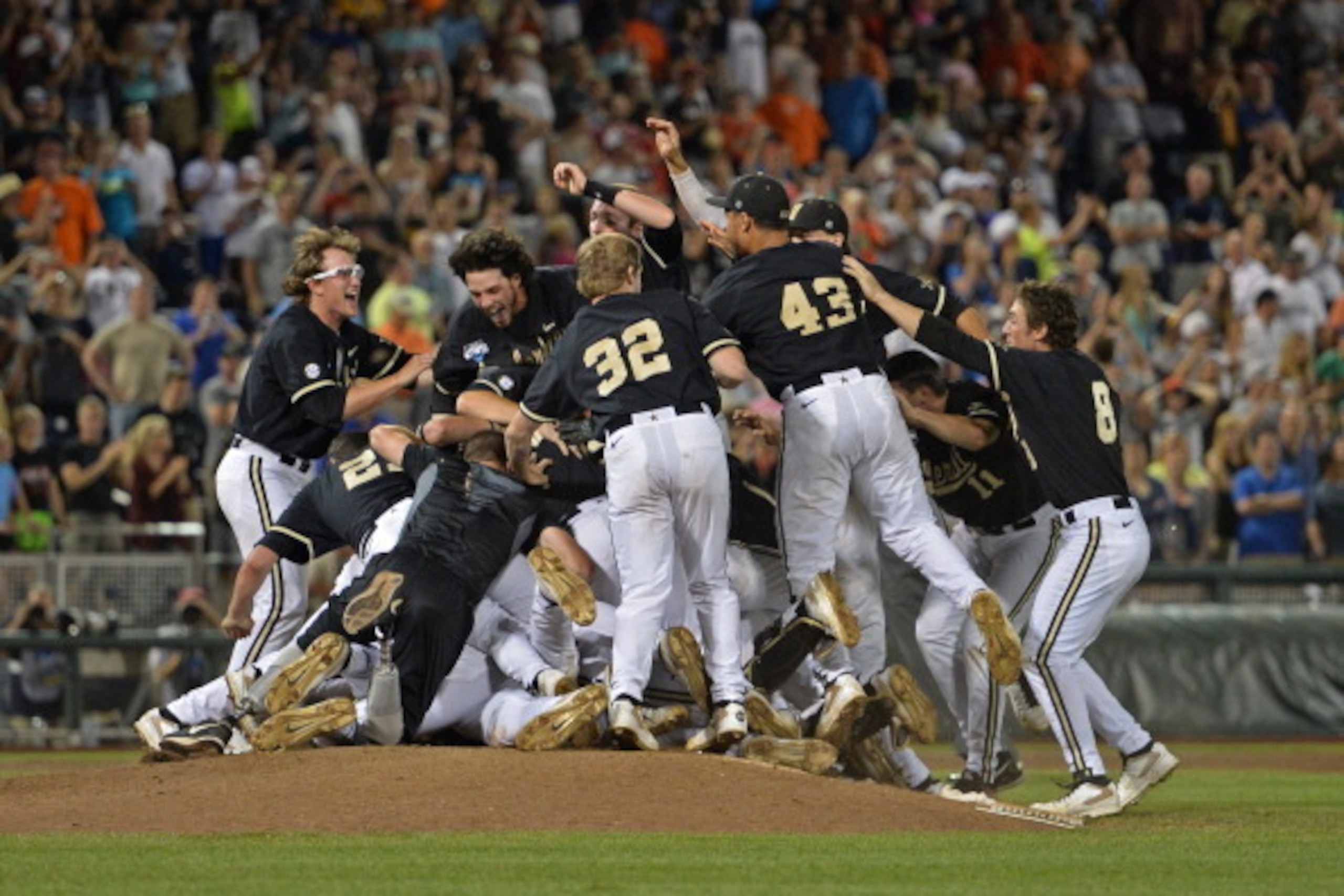 Omaha, NE - JUNE 25:  Vanderbilt Commodores players celebrate after beating the Virginia Cavaliers 3-2 to win the College World Series Championship Series on June 25, 2014 at TD Ameritrade Park in Omaha, Nebraska.  (Photo by Peter Aiken/Getty Images)