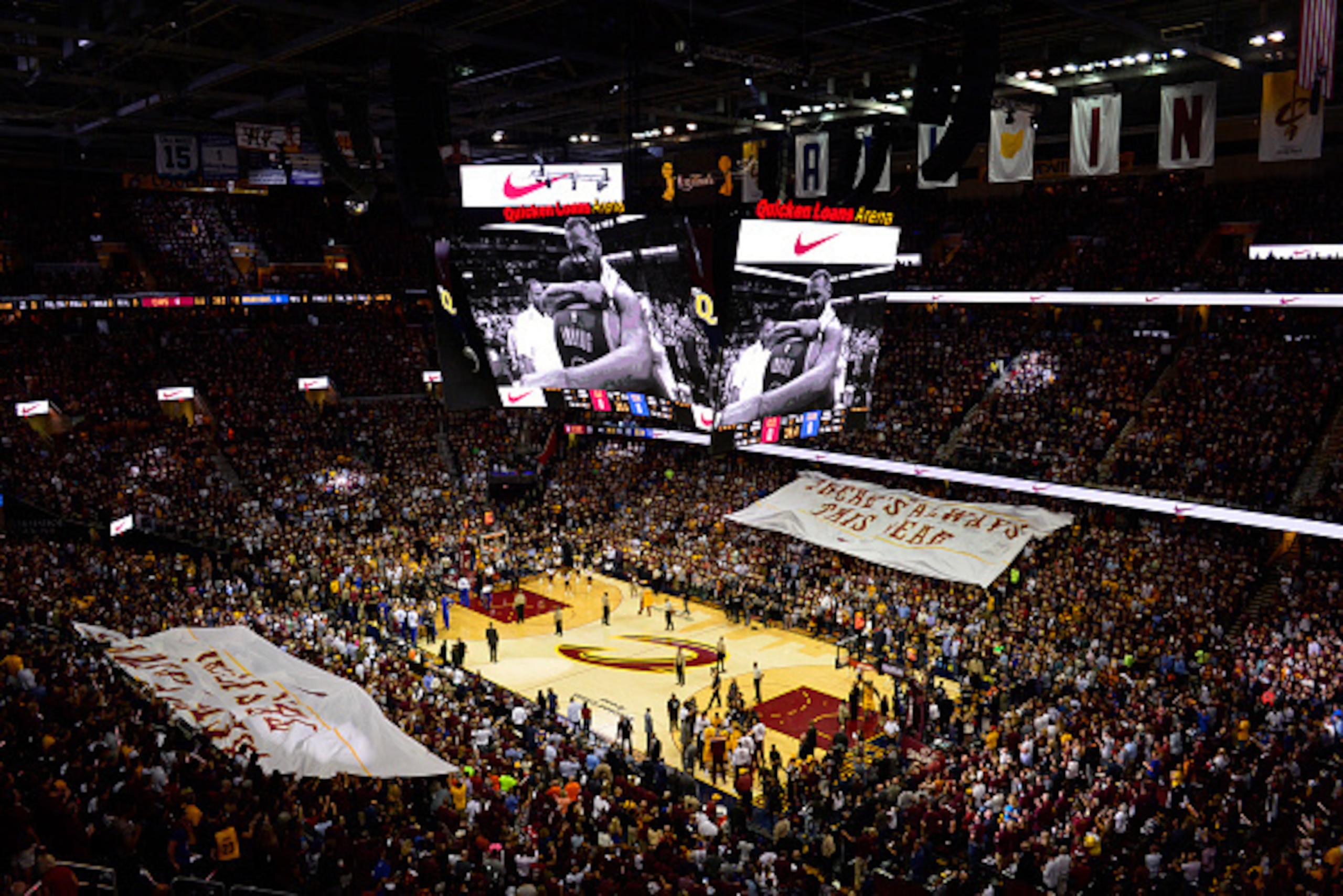 CLEVELAND, OH - JUNE 9: Fans passes a banner prior to the game of the Golden State Warriors against the Cleveland Cavaliers in Game Three of the 2015 NBA Finals on June 9, 2015 at Quicken Loans Arena in Cleveland, Ohio. NOTE TO USER: User expressly acknow