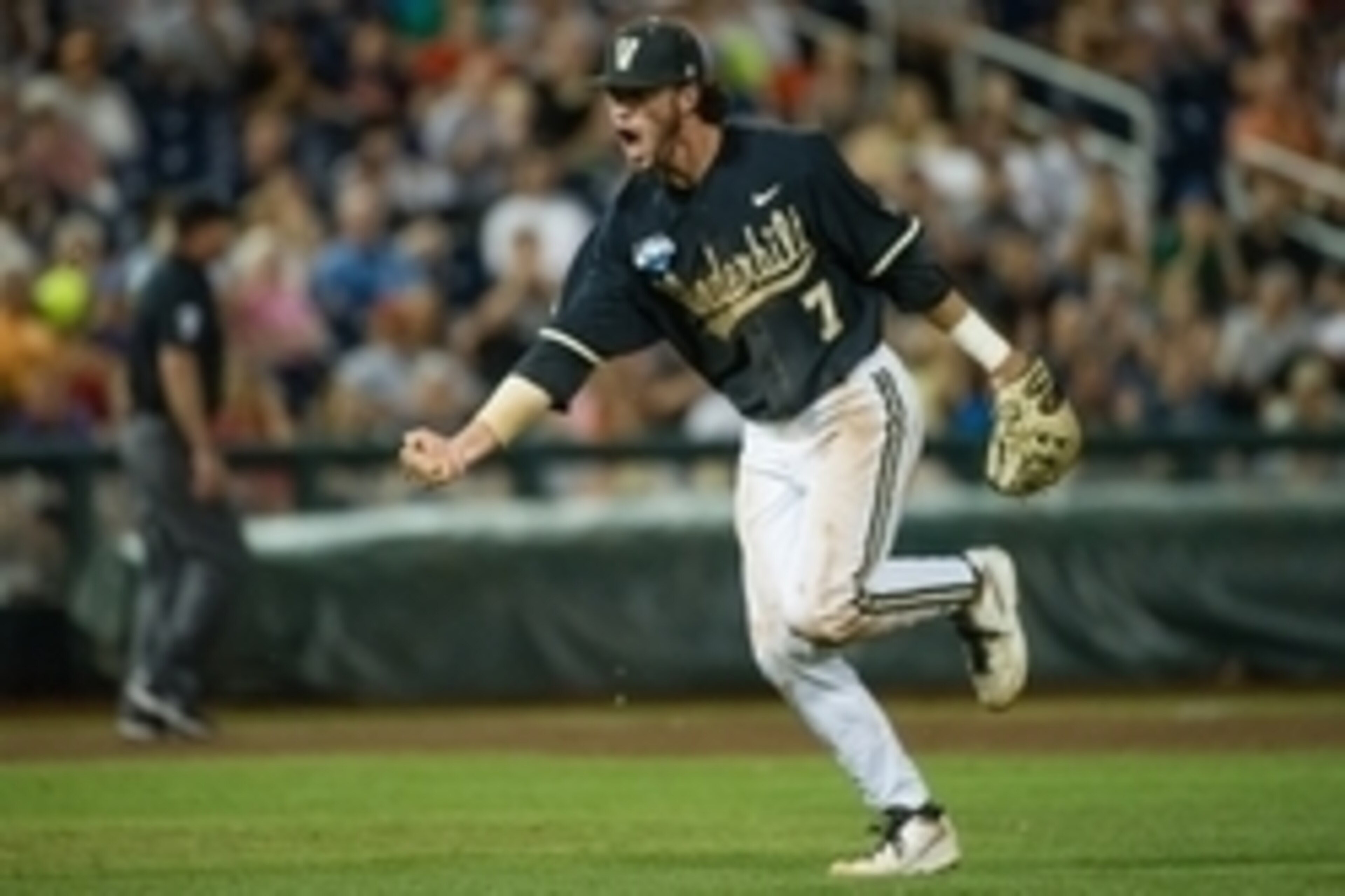 Jun 25, 2014; Omaha, NE, USA; Vanderbilt Commodores infielder Dansby Swanson (7) celebrates an inning ending play in the eighth inning against the Virginia Cavaliers during game three of the College World Series Finals at TD Ameritrade Park Omaha. Vanderb Jun 25, 2014; Omaha, NE, USA; Vanderbilt Commodores infielder Dansby Swanson (7) celebrates an inning ending play in the eighth inning against the Virginia Cavaliers during game three of the College World Series Finals at TD Ameritrade Park Omaha. Vanderb
