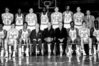 NEW YORK - 1970: The World Champions of basketball New York Knickerbockers pose for a team portrait seated (L-R): John Warren, Don May, Walt Frazier, President Ned Irish, Chairman of the board Irving Mitchell Felt, G. M. Ed Donovan, Dick Barnett, Mike Rio
