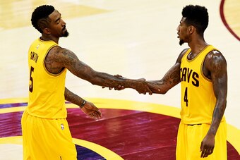CLEVELAND, OH - MAY 24:  J.R. Smith #5 and Iman Shumpert #4 of the Cleveland Cavaliers celebrate a three pointer by Smith in the fourth quarter against the Atlanta Hawks during Game Three of the Eastern Conference Finals of the 2015 NBA Playoffs at Quicke