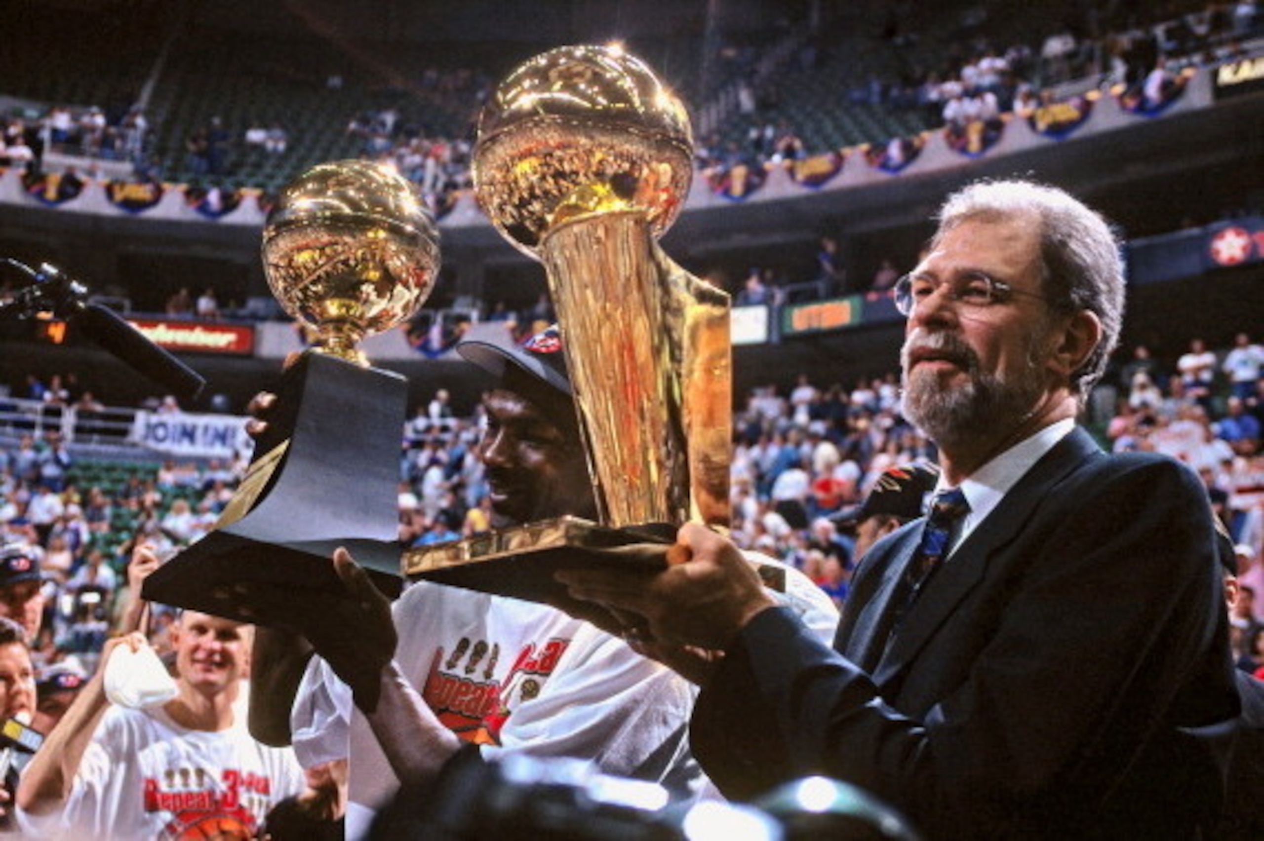 SALT LAKE CITY, UT - JUNE 14: Phil Jackson of the Chicago Bulls celebrates after winning Game Six of the 1998 NBA Finals against the Utah Jazz on June 14, 1998 at the Delta Center in Salt Lake City, Utah. The Chicago Bulls defeated the Utah Jazz 4-2 to wi SALT LAKE CITY, UT - JUNE 14: Phil Jackson of the Chicago Bulls celebrates after winning Game Six of the 1998 NBA Finals against the Utah Jazz on June 14, 1998 at the Delta Center in Salt Lake City, Utah. The Chicago Bulls defeated the Utah Jazz 4-2 to wi