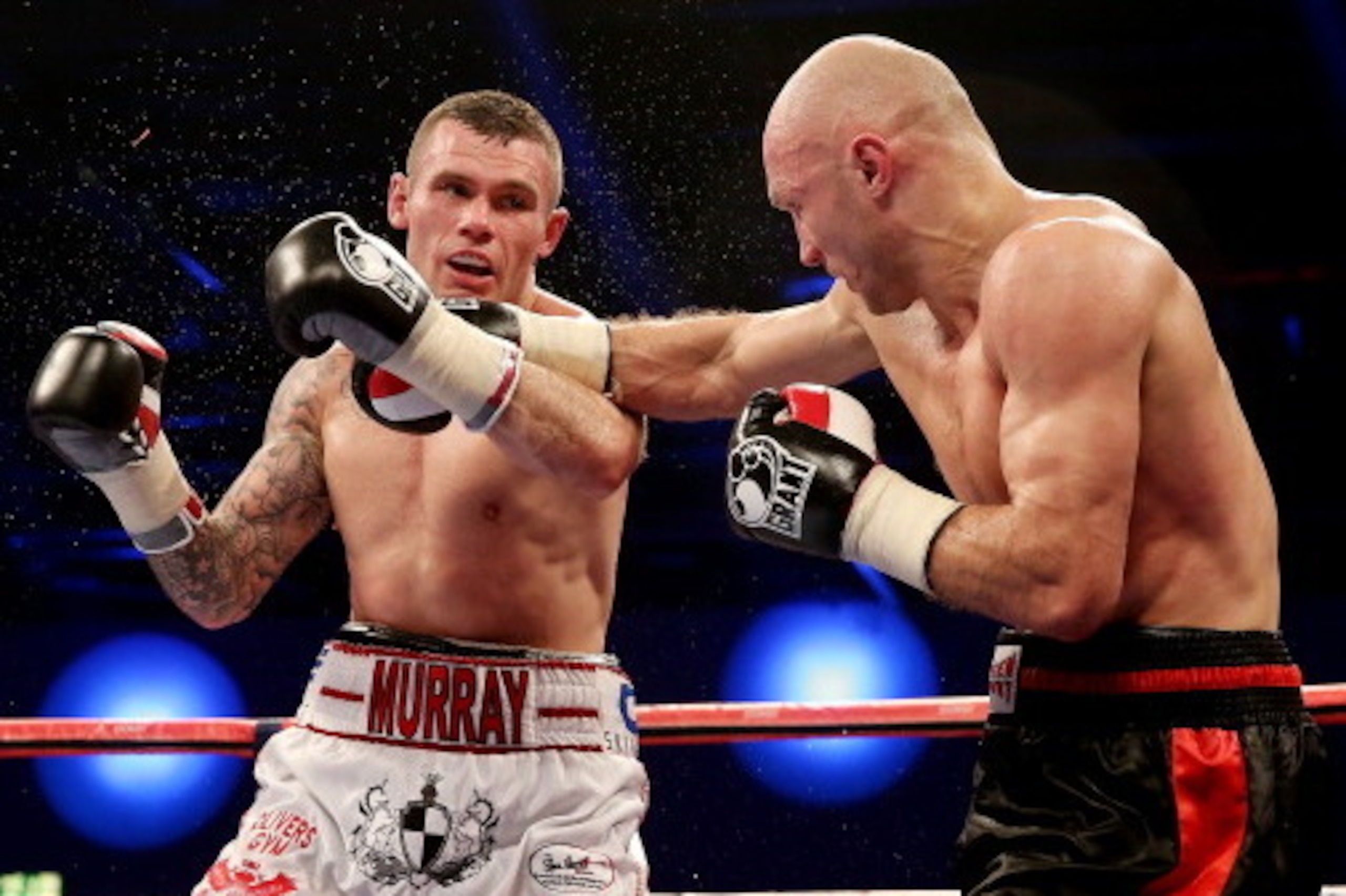 LONDON, ENGLAND - DECEMBER 14:  Martin Murray (L) in actcion with Sergey Khomitsky during their Middleweight bout at ExCel on December 14, 2013 in London, England.  (Photo by Scott Heavey/Getty Images)