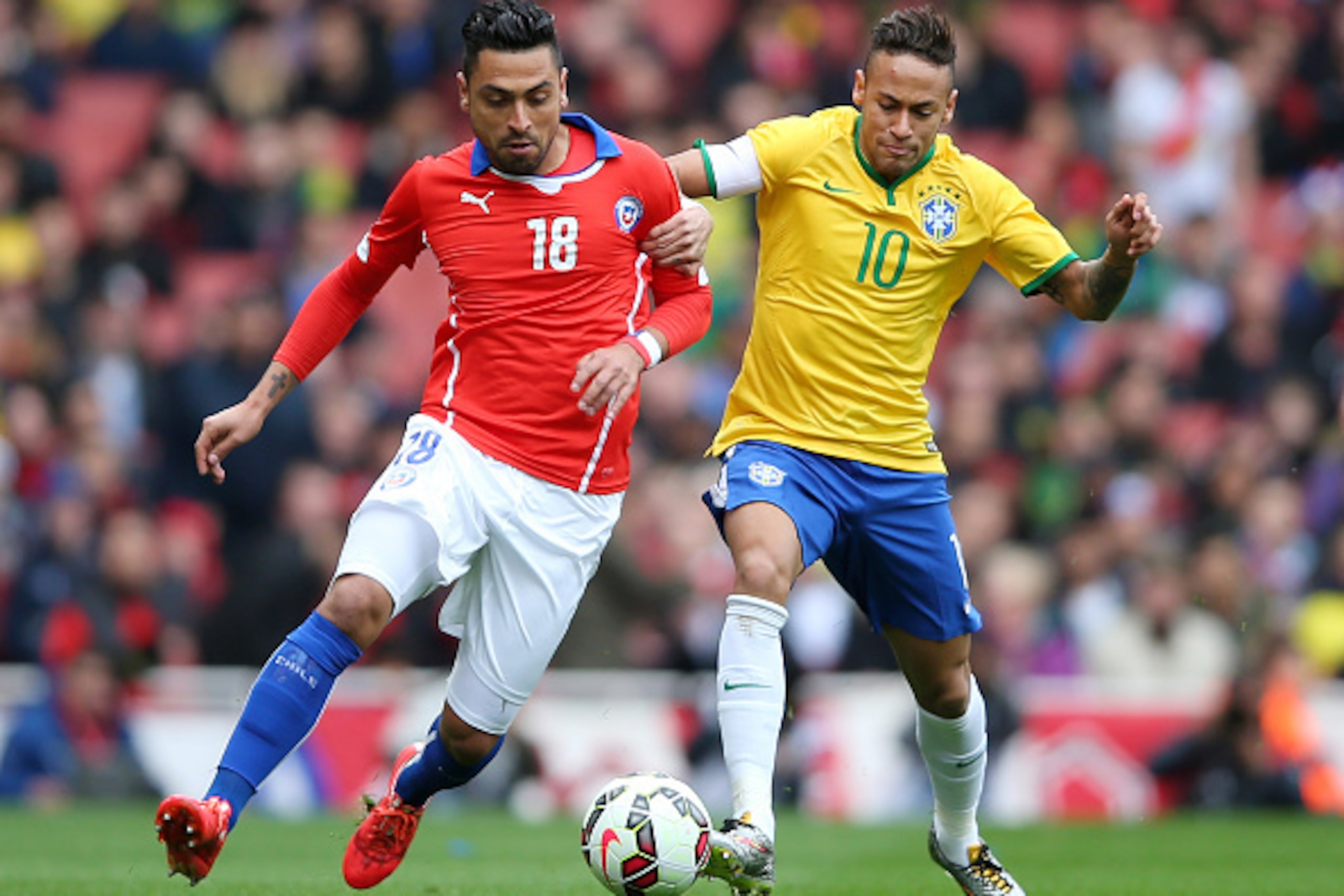 LONDON, ENGLAND - MARCH 29: Gonzalo Jara of Chile and Neymar of Brazil comnpete for the ball during the international friendly match between Brazil and Chile at the Emirates Stadium on March 29, 2015 in London, England. (Photo by Paul Gilham/Getty Image LONDON, ENGLAND - MARCH 29: Gonzalo Jara of Chile and Neymar of Brazil comnpete for the ball during the international friendly match between Brazil and Chile at the Emirates Stadium on March 29, 2015 in London, England. (Photo by Paul Gilham/Getty Image