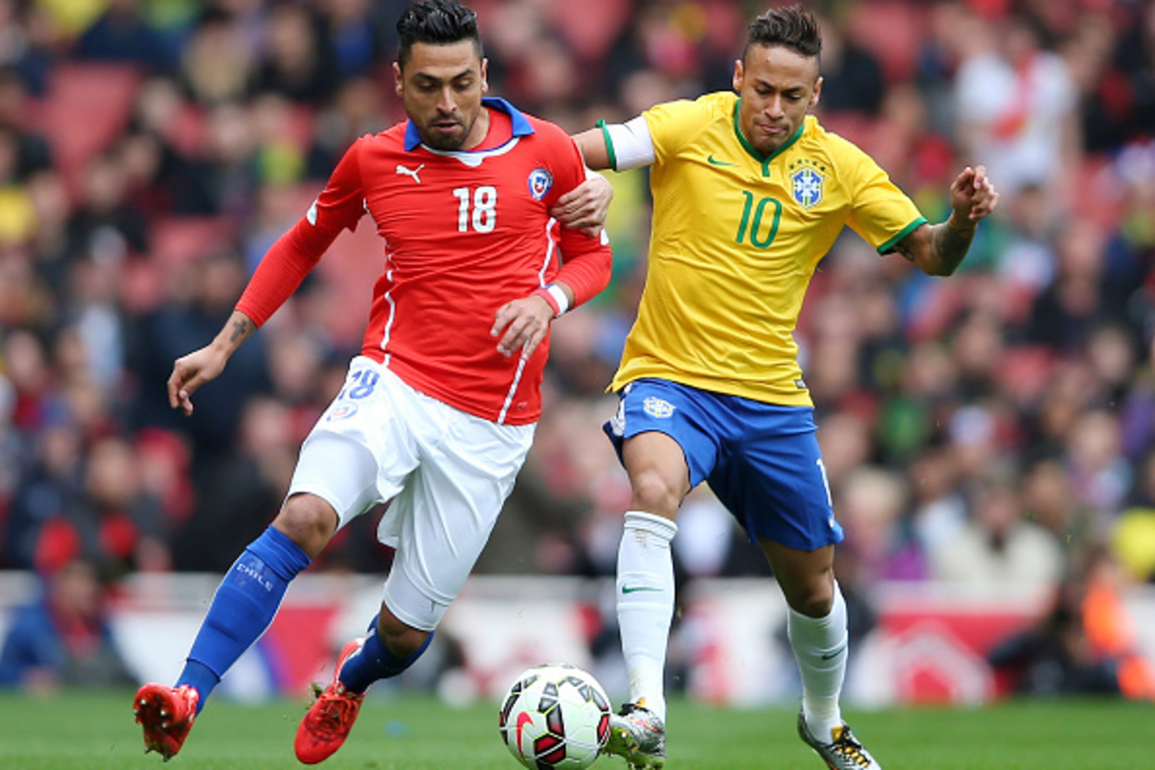 LONDON, ENGLAND - MARCH 29: Gonzalo Jara of Chile and Neymar of Brazil comnpete for the ball during the international friendly match between Brazil and Chile at the Emirates Stadium on March 29, 2015 in London, England. (Photo by Paul Gilham/Getty Image LONDON, ENGLAND - MARCH 29: Gonzalo Jara of Chile and Neymar of Brazil comnpete for the ball during the international friendly match between Brazil and Chile at the Emirates Stadium on March 29, 2015 in London, England. (Photo by Paul Gilham/Getty Image