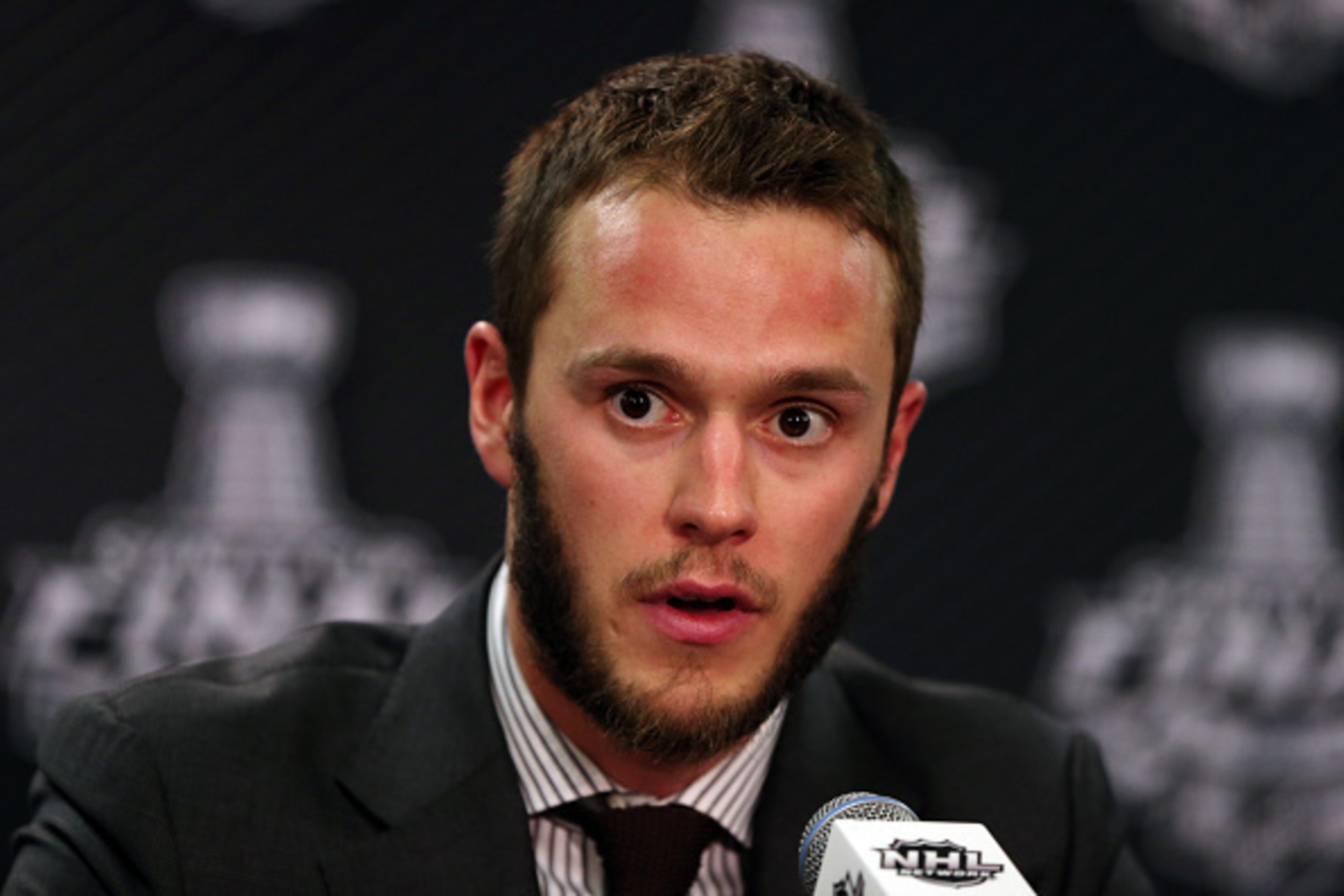 CHICAGO, IL - JUNE 10:  Jonathan Toews #19 of the Chicago Blackhawks speaks to the media after defeating the Tampa Bay Lightning 2-1 in Game Four of the 2015 NHL Stanley Cup Final at the United Center on June 10, 2015 in Chicago, Illinois.  (Photo by Jona