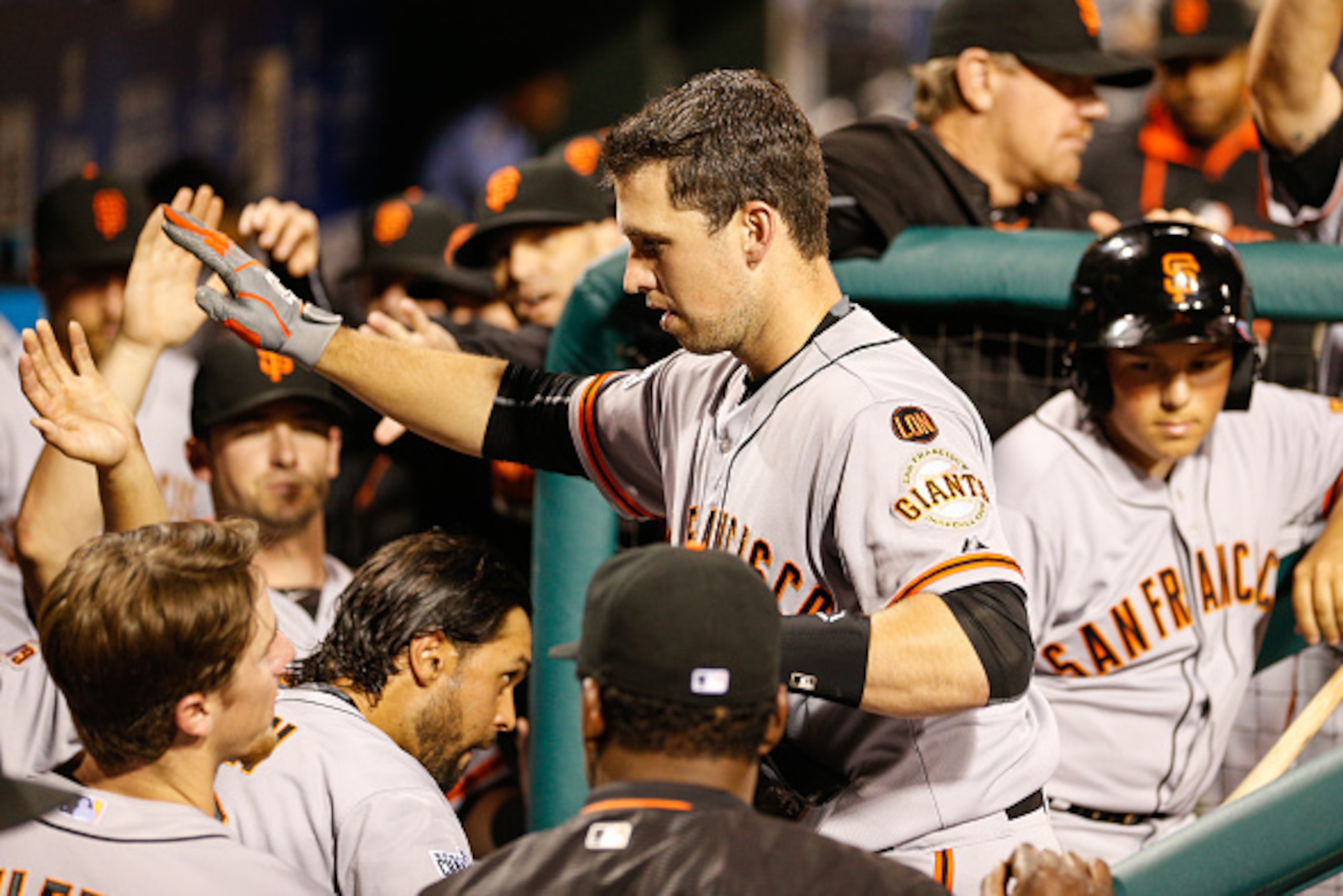 PHILADELPHIA, PA - JUNE 05: Buster Posey #28 of the San Francisco Giants is congratulated by teammates after hitting a solo home run in the seventh inning of the game against the Philadelphia Phillies at Citizens Bank Park on June 5, 2015 in Philadelphia,