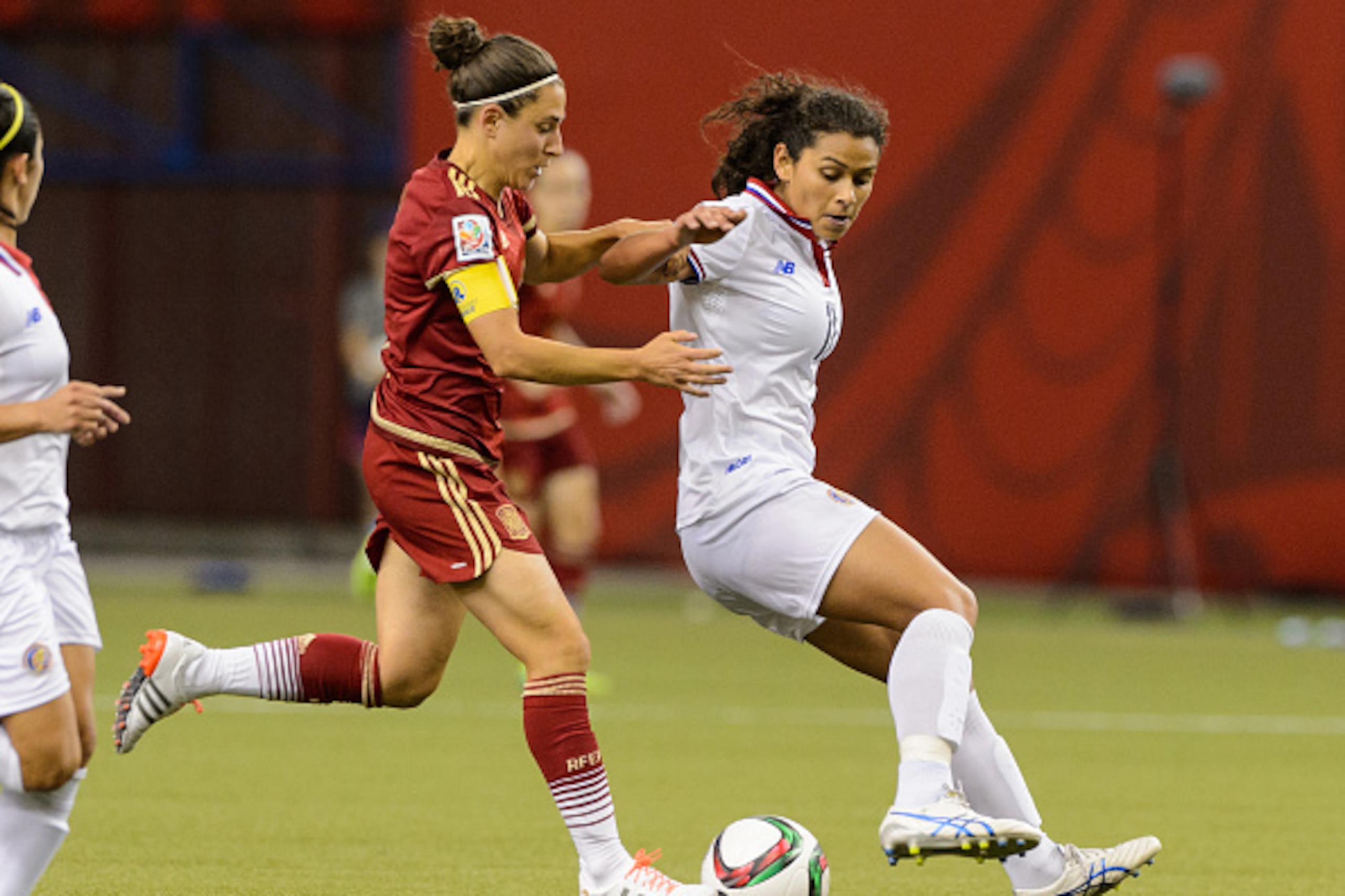 MONTREAL, QC - JUNE 09:  Veronica Boquete #9 of Spain challenges Raquel Rodriguez Cedeno #11 of Costa Rica during the 2015 FIFA Women's World Cup Group E match at Olympic Stadium on June 9, 2015 in Montreal, Quebec, Canada. The final score between Spain a