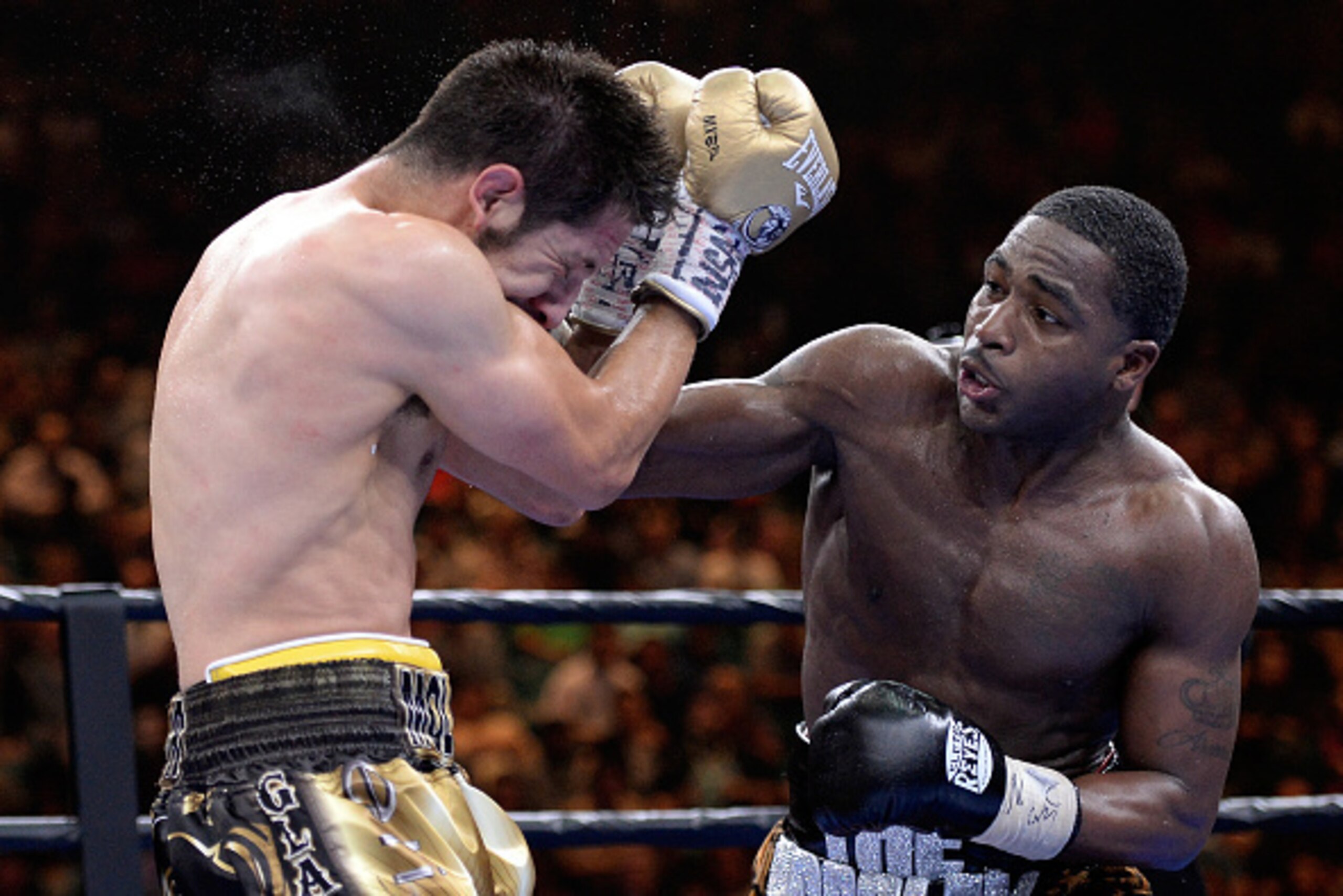 LAS VEGAS, NV - MARCH 07:  Adrien Broner punches John Molina Jr. during a Premier Boxing Champions bout in the MGM Grand Garden Arena on March 7, 2015 in Las Vegas, Nevada.  (Photo by Harry How/Getty Images)