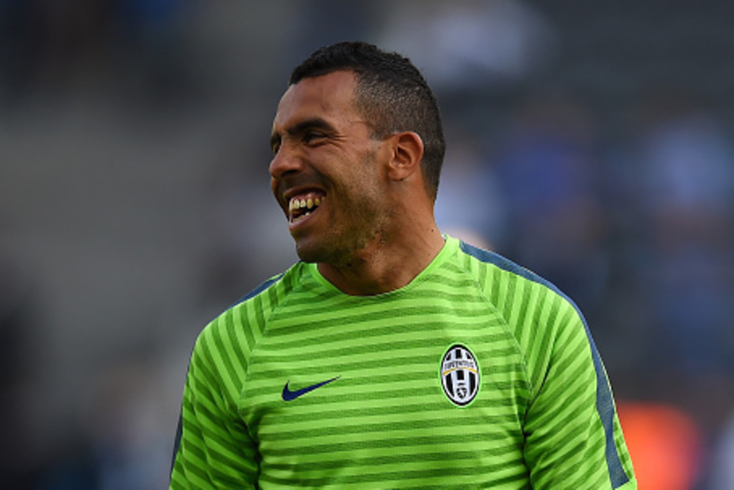 BERLIN, GERMANY - JUNE 05:  Carlos Tevez of Juventus smiles during a Juventus training session on the eve of the UEFA Champions League Final match against FC Barcelona at Olympiastadion on June 5, 2015 in Berlin, Germany.  (Photo by Laurence Griffiths/Get