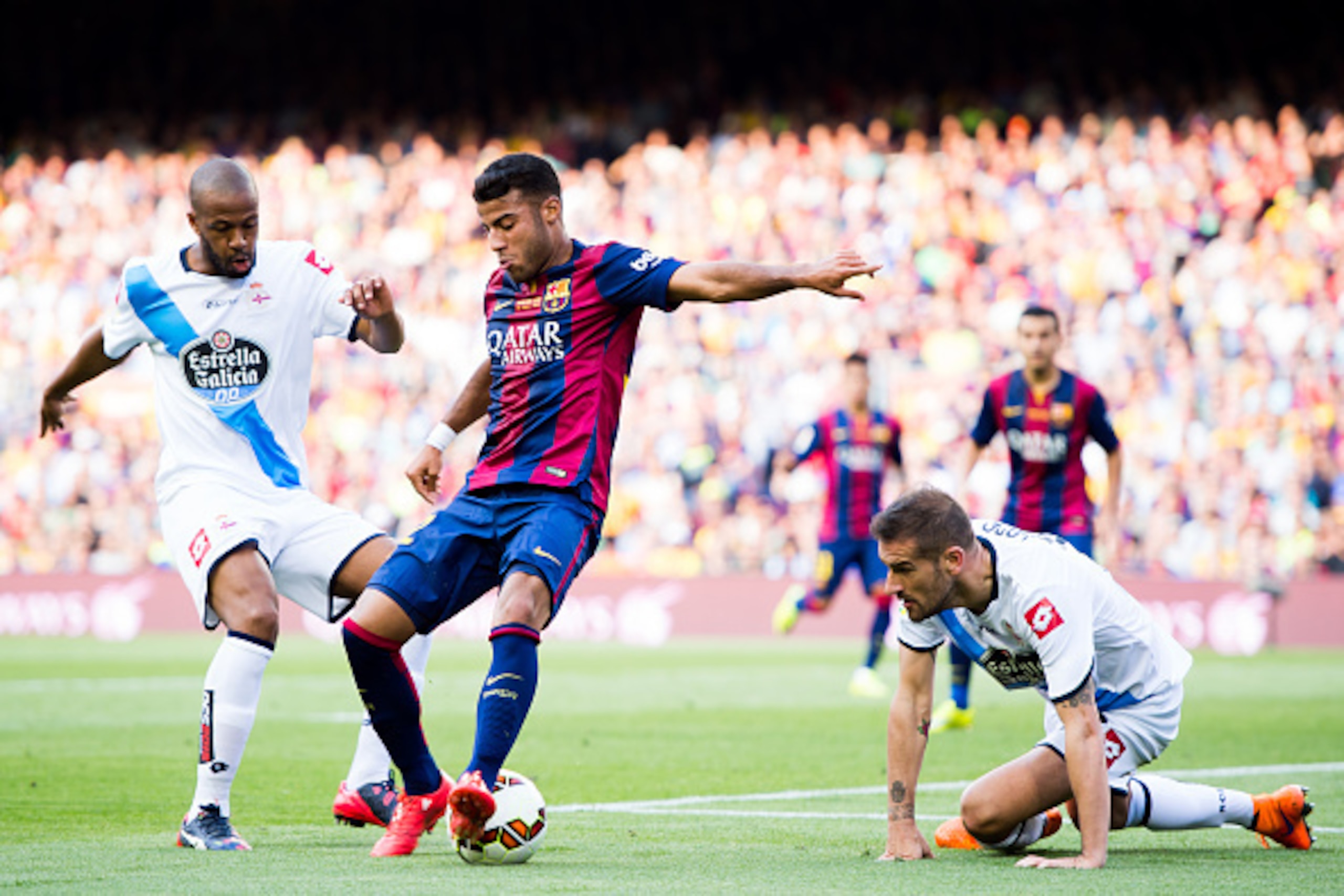 BARCELONA, SPAIN - MAY 23: Rafinha (C) of FC Barcelona controls the ball between Sidnei (L) and Alberto Lopo (R) of RC Deportivo La Coruna during the La Liga match between FC Barcelona and RC Deportivo La Coruna at Camp Nou on May 23, 2015 in Barcelona, S BARCELONA, SPAIN - MAY 23: Rafinha (C) of FC Barcelona controls the ball between Sidnei (L) and Alberto Lopo (R) of RC Deportivo La Coruna during the La Liga match between FC Barcelona and RC Deportivo La Coruna at Camp Nou on May 23, 2015 in Barcelona, S