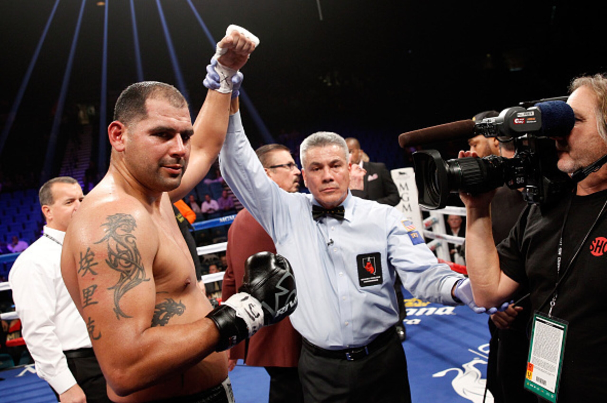 LAS VEGAS, NV - JANUARY 17:  Eric Molina has his arm raised by referee Russell Mora after beating Raphael Zumbano in a heavyweight fight at the MGM Grand Garden Arena on January 17, 2015 in Las Vegas, Nevada. Molina won with an eighth-round TKO.  (Photo b