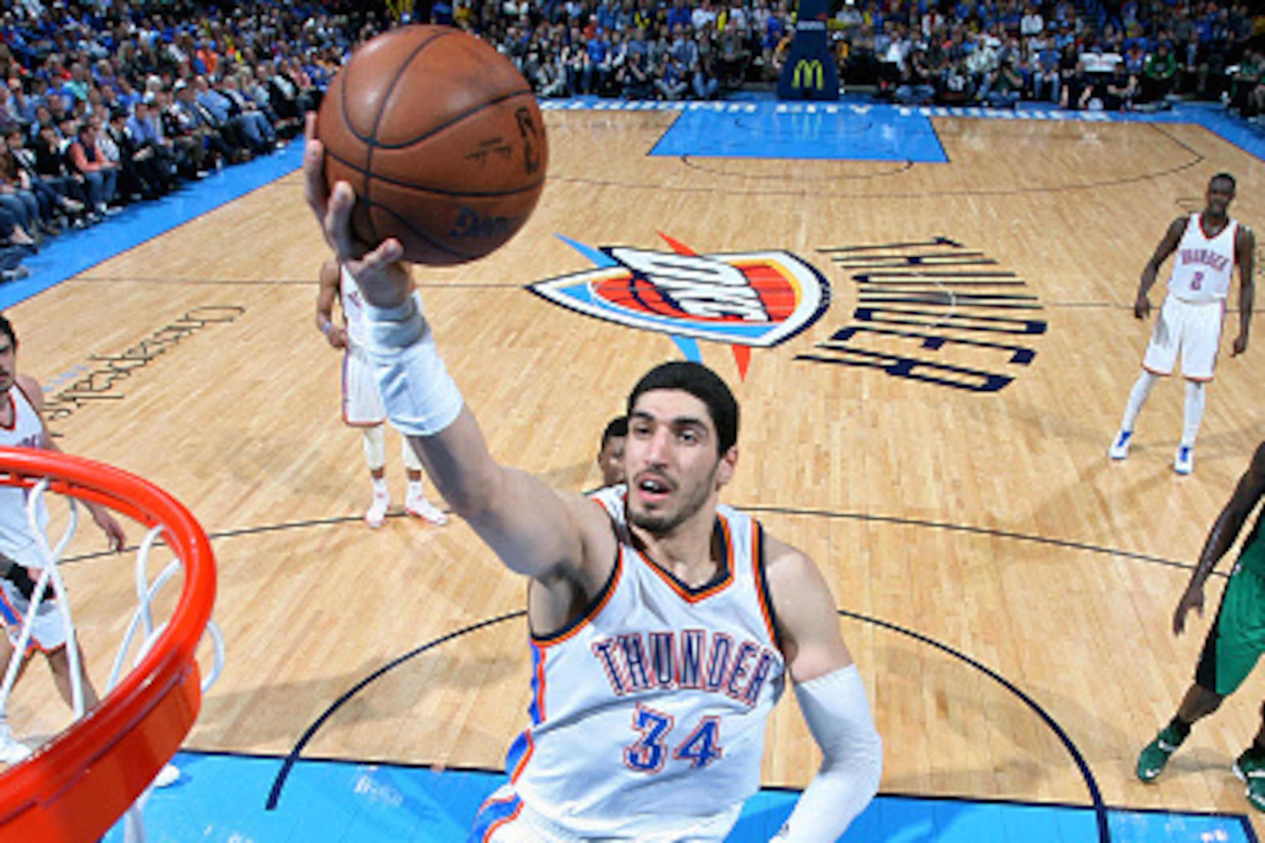OKLAHOMA CITY, OK - MARCH 18: Enes Kanter #34 of the Oklahoma City Thunder shoots against the Boston Celtics on March 18, 2015 at the Chesapeake Energy Arena in Oklahoma City, Oklahoma. NOTE TO USER: User expressly acknowledges and agrees that, by downloa
