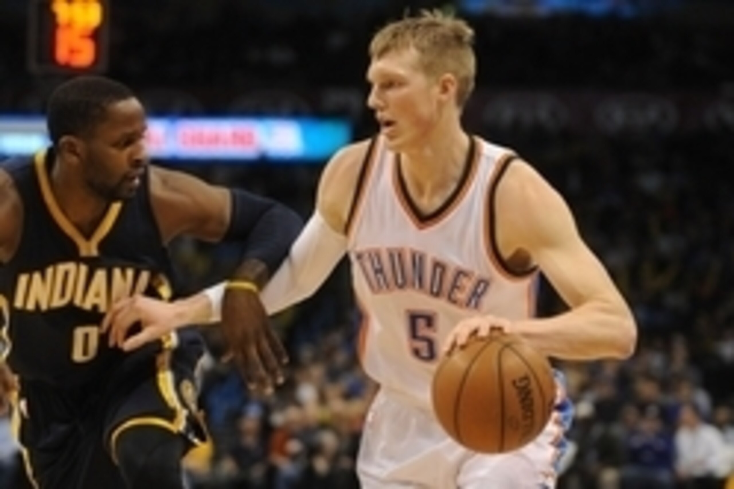 Feb 24, 2015; Oklahoma City, OK, USA;  Oklahoma City Thunder forward Kyle Singler (5) handles the ball against Indiana Pacers guard C.J. Miles (0) during the first quarter at Chesapeake Energy Arena. Mandatory Credit: Mark D. Smith-USA TODAY Sports