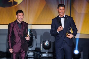 ZURICH, SWITZERLAND - JANUARY 12: FIFA Ballon d'Or nominees Lionel Messi of Argentina and FC Barcelona  (L) and Cristiano Ronaldo of Portugal and Real Madrid smile during the FIFA Ballon d'Or Gala 2014 at the Kongresshaus on January 12, 2015 in Zurich, Sw