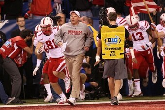 INDIANAPOLIS, IN - DECEMBER 01:  Nebraska Cornhuskers head coach Bo Pelini leds his team onto the field prior to the start of the Big Ten Championship game against the Wisconsin Badgers at Lucas Oil Stadium on December 1, 2012 in Indianapolis, Indiana.  (