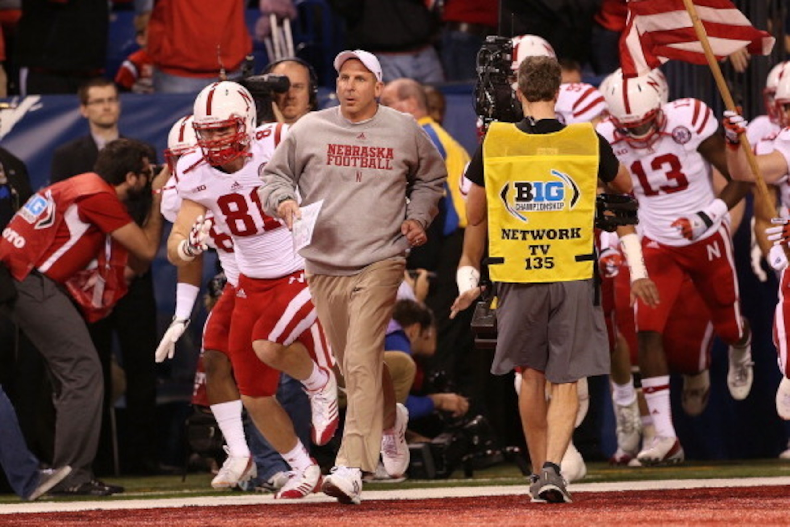 INDIANAPOLIS, IN - DECEMBER 01:  Nebraska Cornhuskers head coach Bo Pelini leds his team onto the field prior to the start of the Big Ten Championship game against the Wisconsin Badgers at Lucas Oil Stadium on December 1, 2012 in Indianapolis, Indiana.  (