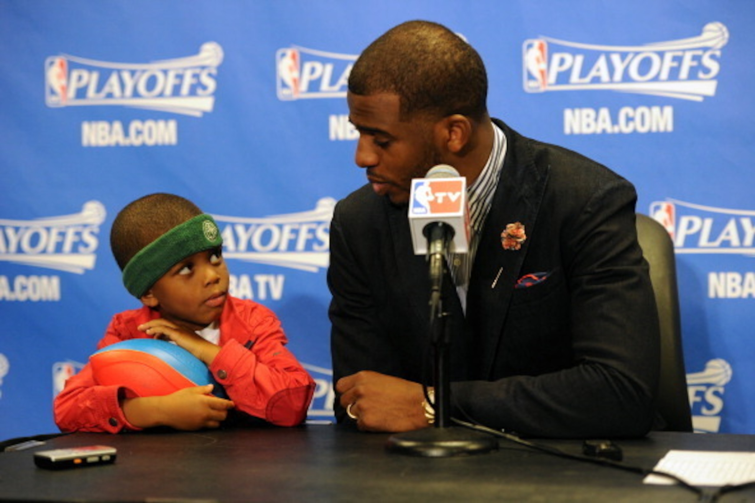 LOS ANGELES, CA - APRIL 21: Chris Paul #3 of the Los Angeles Clippers and his son Chris Paul II attend a post game press conference after Game Two of the Western Conference Quarterfinals at Staples Center on April 21, 2014 in Los Angeles, California. NOT LOS ANGELES, CA - APRIL 21: Chris Paul #3 of the Los Angeles Clippers and his son Chris Paul II attend a post game press conference after Game Two of the Western Conference Quarterfinals at Staples Center on April 21, 2014 in Los Angeles, California. NOT