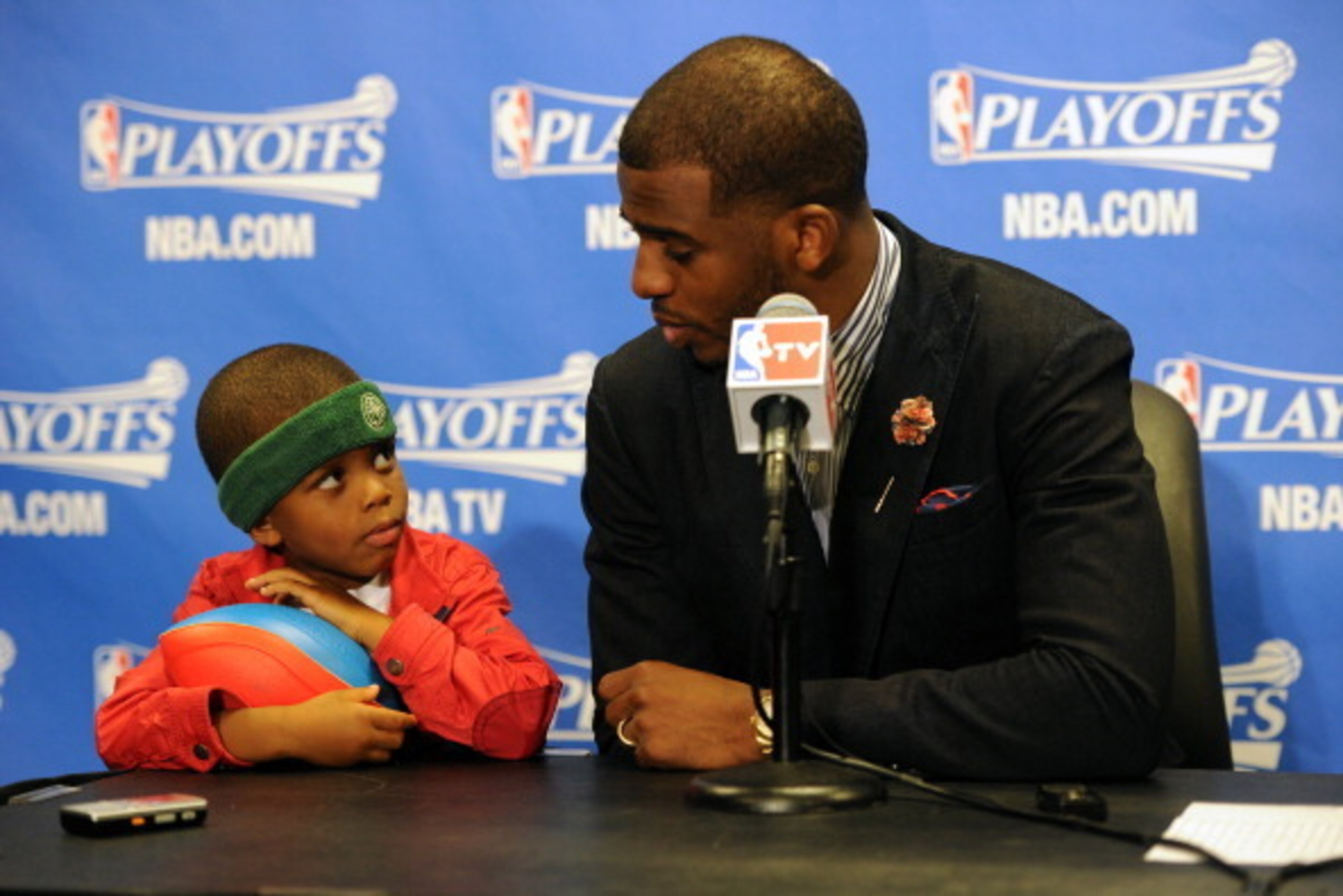 LOS ANGELES, CA - APRIL 21:  Chris Paul #3 of the Los Angeles Clippers and his son Chris Paul II attend a post game press conference after Game Two of the Western Conference Quarterfinals at Staples Center on April 21, 2014 in Los Angeles, California. NOT