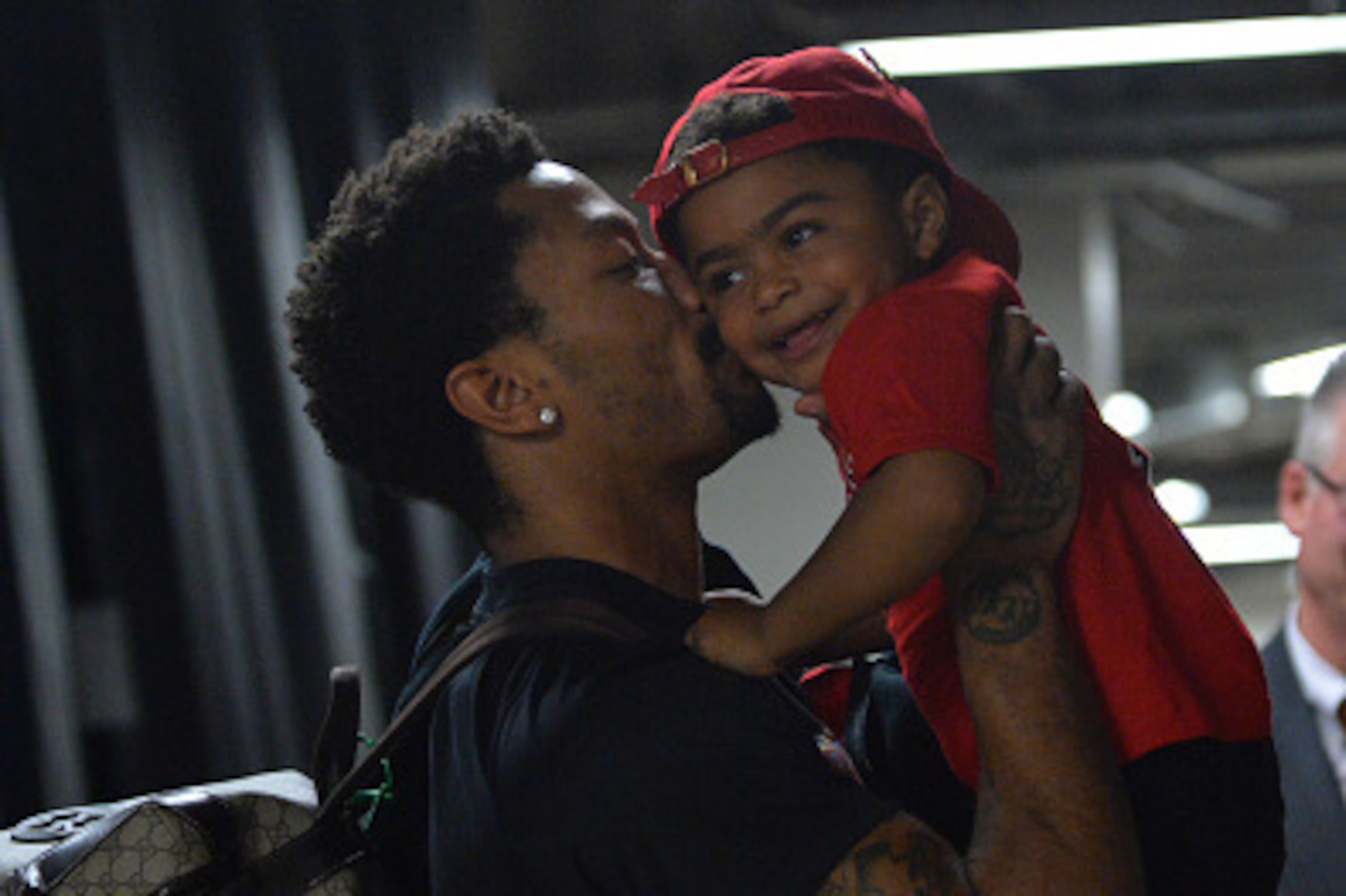 CHICAGO,IL - MAY 8: Derrick Rose #1 of the Chicago Bulls gives his son P.J. a kiss after hitting the game winning shot against the Cleveland Cavaliers at the United Center During Game Three of the Eastern Conference Semifinals during the 2015 NBA Playoffs CHICAGO,IL - MAY 8: Derrick Rose #1 of the Chicago Bulls gives his son P.J. a kiss after hitting the game winning shot against the Cleveland Cavaliers at the United Center During Game Three of the Eastern Conference Semifinals during the 2015 NBA Playoffs