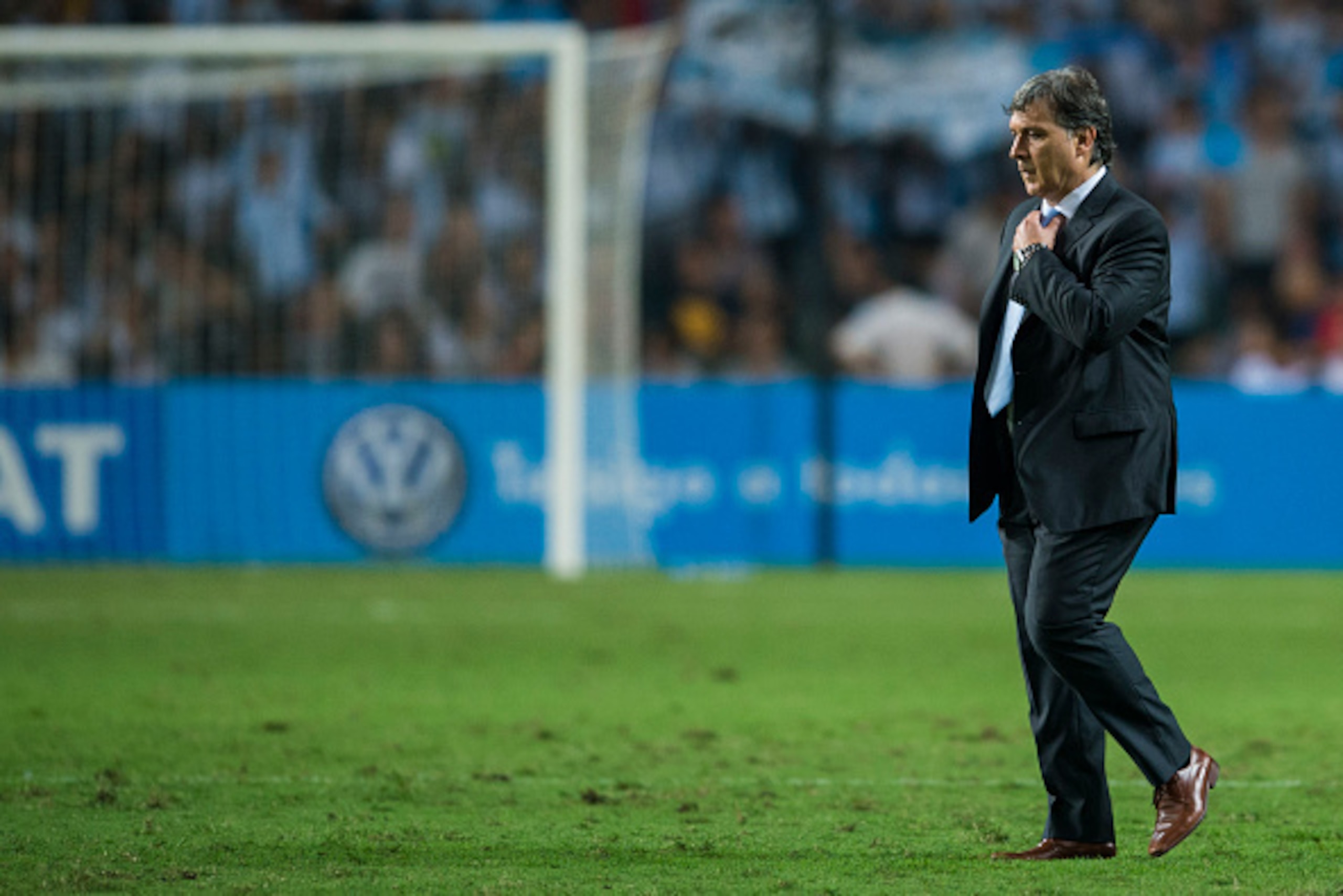 HONG KONG - OCTOBER 14:  Argentina Head Coach, Gerardo Martino leaves the pitch after the International Friendly Match between Hong Kong and Argentina at the Hong Kong Stadium on October 14, 2014 in Hong Kong, Hong Kong.  (Photo by Victor Fraile/Getty Ima