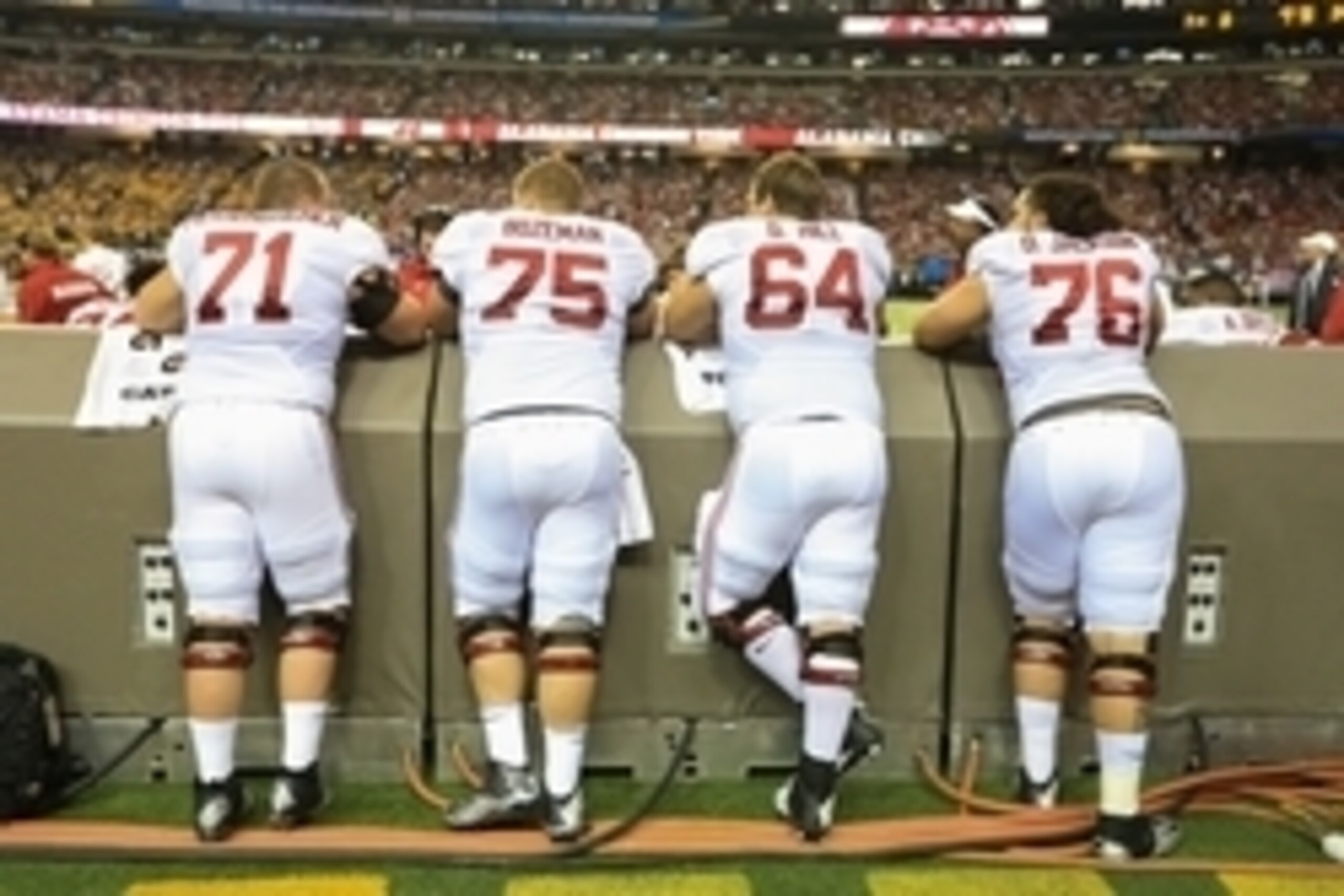 Dec 6, 2014; Atlanta, GA, USA; From left: Alabama Crimson Tide offensive linemen Ross Pierschbacher (71), Bradley Bozeman (75), Grant Hill (64), and Dominick Jackson (76) on the sideline during the 2014 SEC Championship Game against the Missouri Tigers at