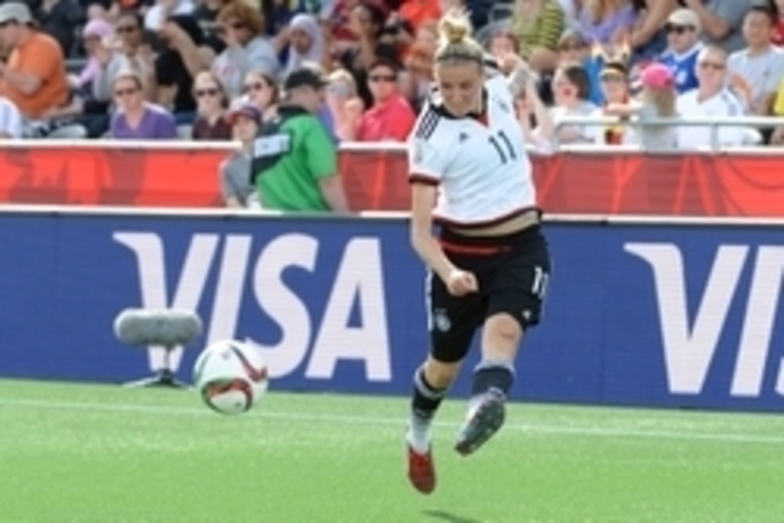 Jun 7, 2015; Ottawa, Ontario, CAN; Germany forward Anja Mittag (11) kicks against Ivory Coast in the second half of a Group B soccer match in the 2015 women's World Cup at Lansdowne Stadium. Mandatory Credit: Marc DesRosiers-USA TODAY Sports