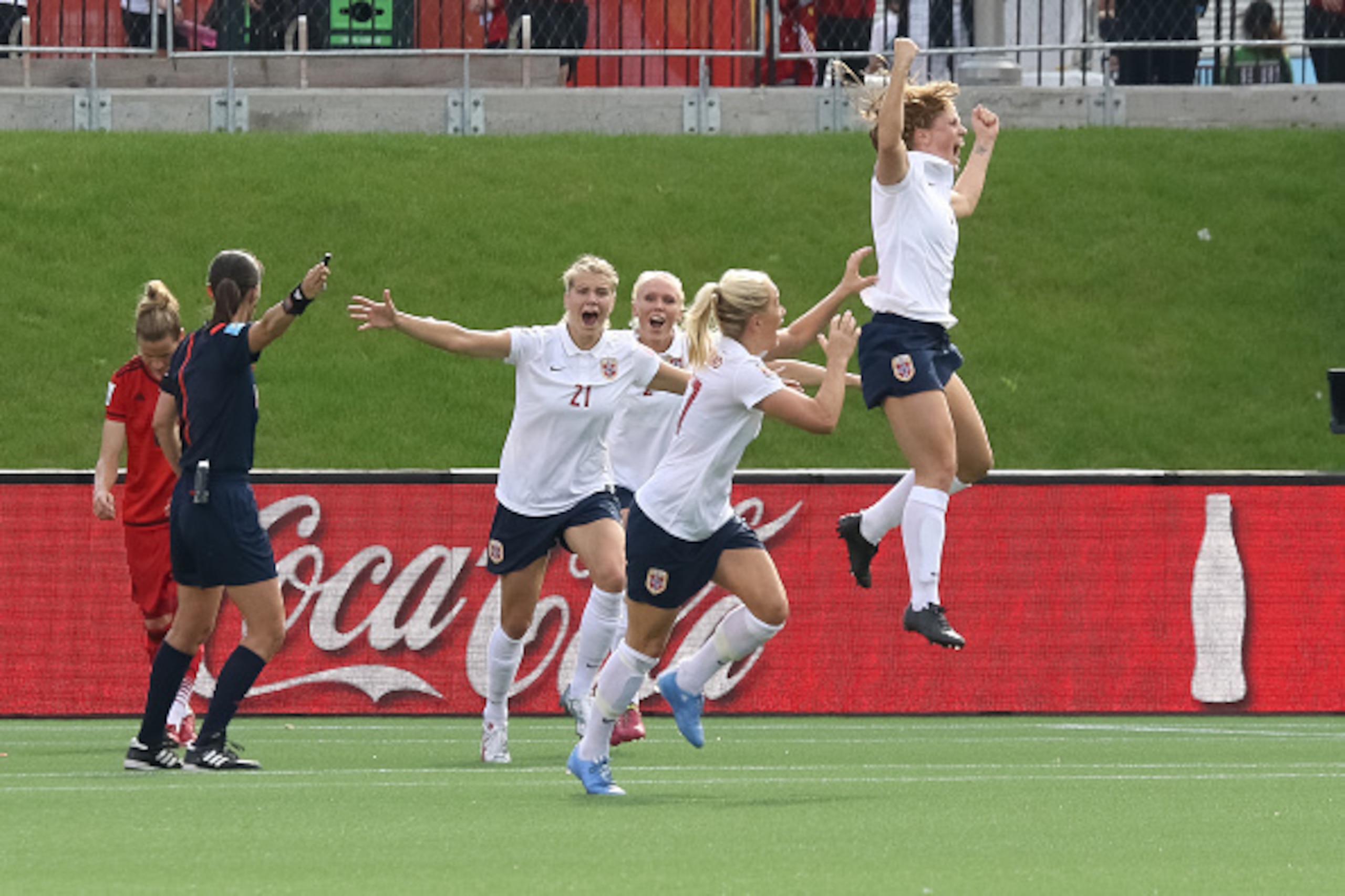 OTTAWA, ON - JUNE 11: Maren Mjelde #6 of Norway celebrates her goal on a direct kick with team mates during the FIFA Women's World Cup Canada 2015 Group B match between Germany and Norway at Lansdowne Stadium on June 11, 2015 in Ottawa, Canada.  (Photo by