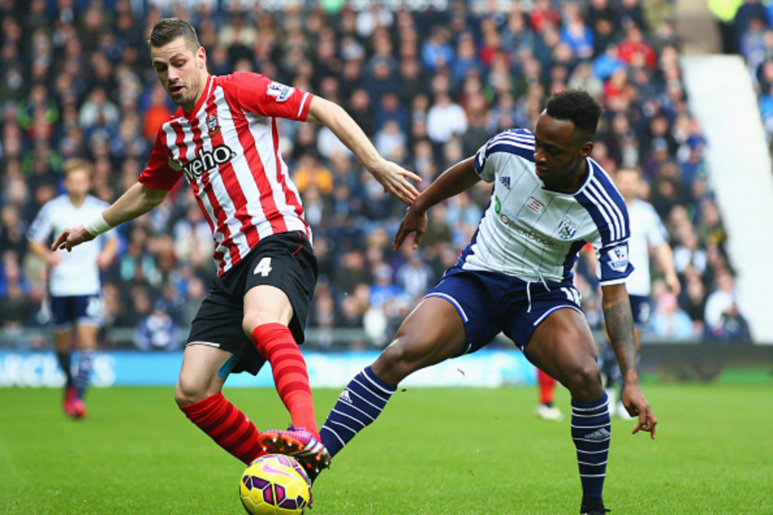 WEST BROMWICH, ENGLAND - FEBRUARY 28: Saido Berahino of West Bromwich Albion and Morgan Schneiderlin of Southampton battle for the ball during the Barclays Premier League match between West Bromwich Albion and Southampton at The Hawthorns on February 28, WEST BROMWICH, ENGLAND - FEBRUARY 28: Saido Berahino of West Bromwich Albion and Morgan Schneiderlin of Southampton battle for the ball during the Barclays Premier League match between West Bromwich Albion and Southampton at The Hawthorns on February 28,