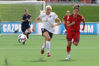 OTTAWA, ON - JUNE 11: Maria Thorisdottir #2 of Norway and Celia Sasic #13 of Germany chase down the ball during the FIFA Women's World Cup Canada 2015 Group B match between Germany and Norway at Lansdowne Stadium on June 11, 2015 in Ottawa, Canada.  (Phot